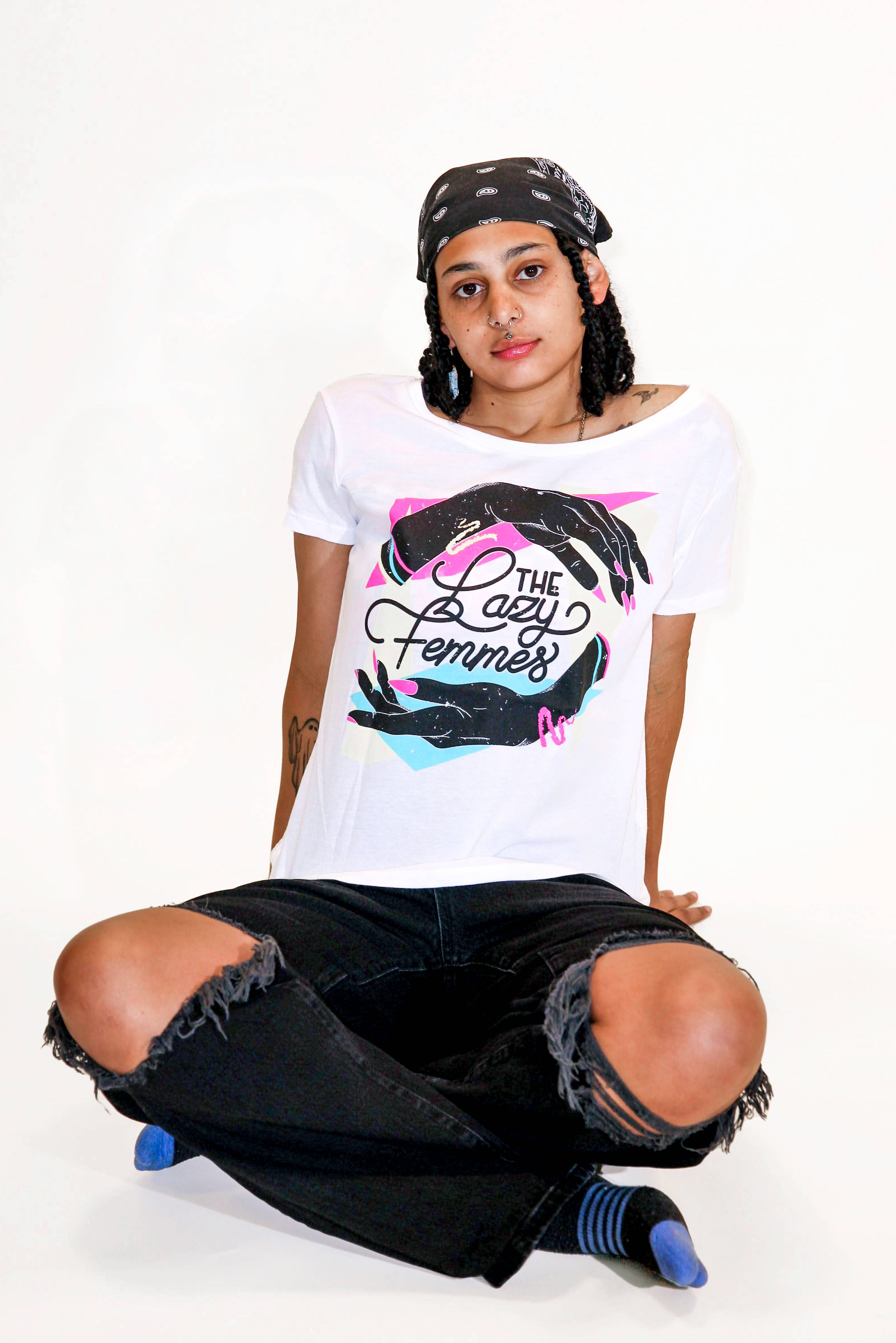 A model is wearing the Lazy Femmes Band Tee in size medium
