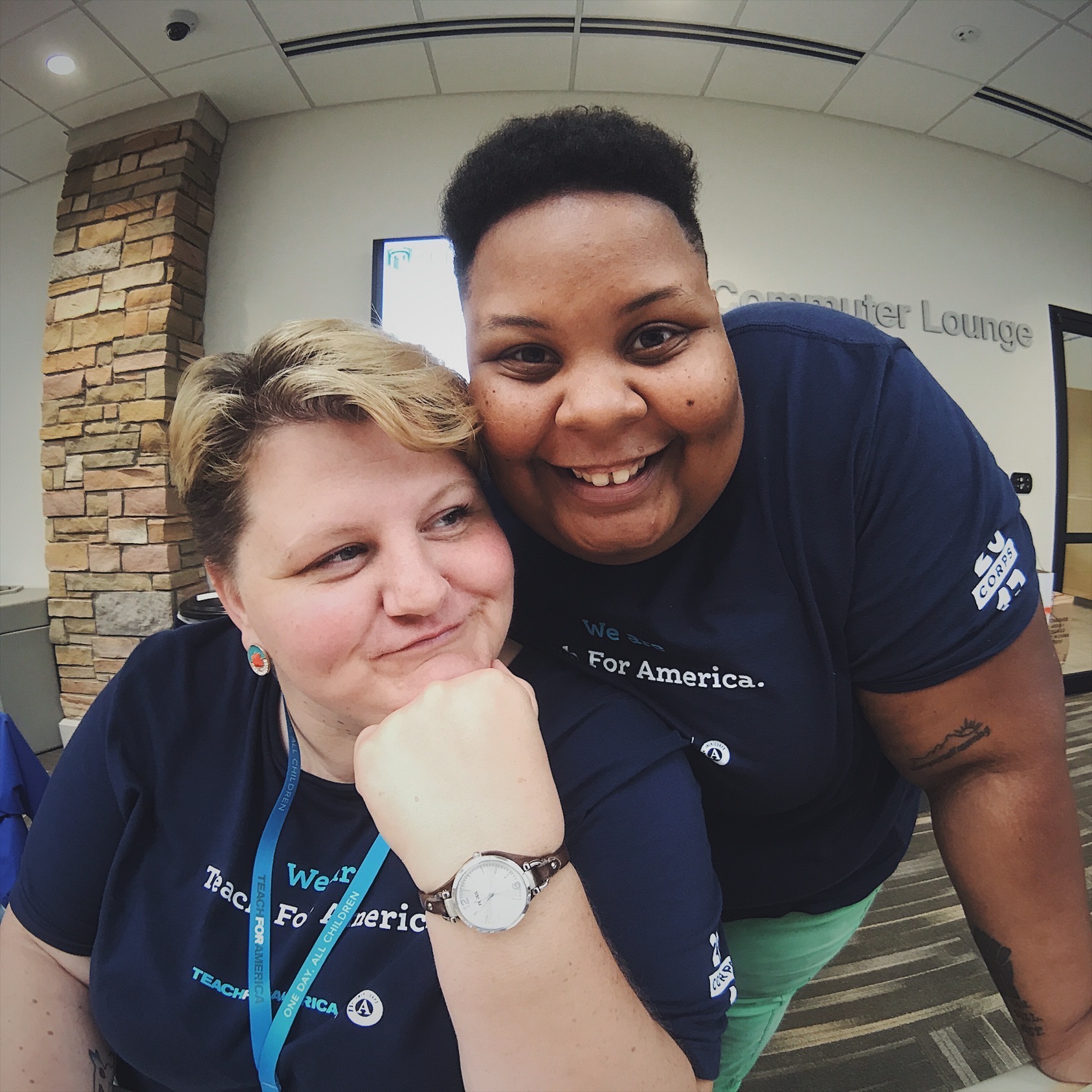 shea and Jane in Teach for America tee shirts pose together and smile.
