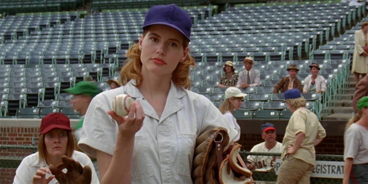 Geena Davis holds a baseball like 