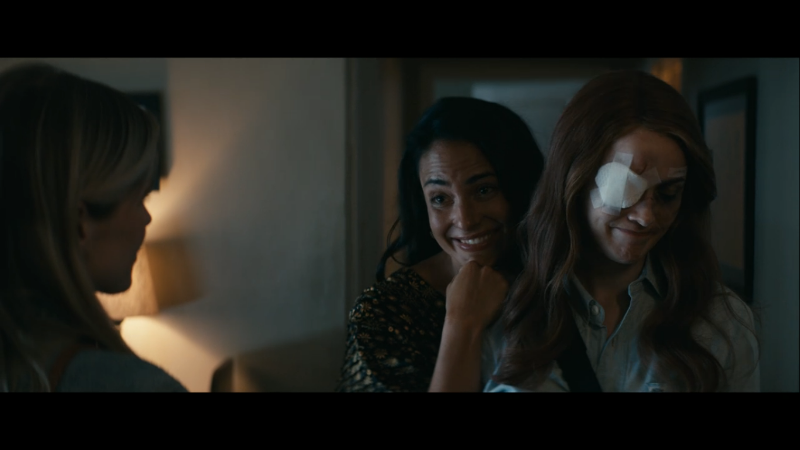 Elena smiles as she leans on Maeve's shoulder, Maeve is blushing and smirking about it