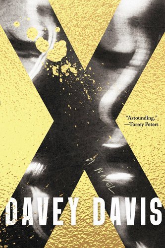 the cover of x is a giant shiny x with gold splattered on and around it