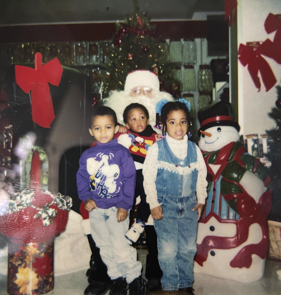 Dave, Dakota, and Dani take a picture with Santa