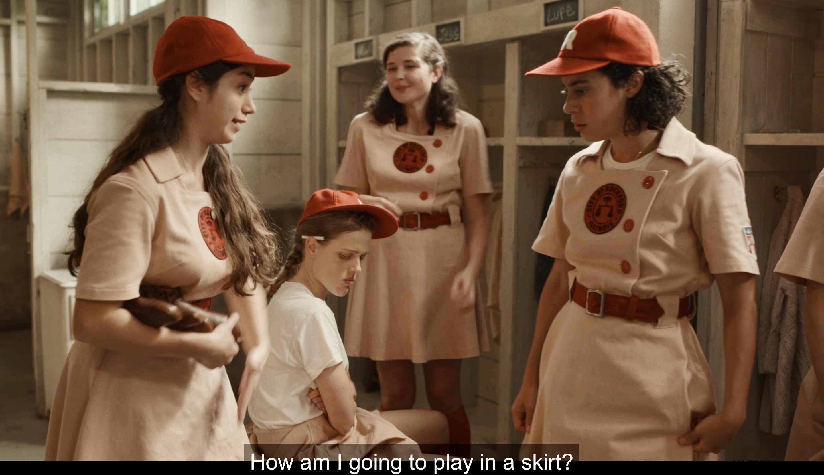 In the Peaches locker room, Esti asks Lupe how is she supposed to play in a skirt