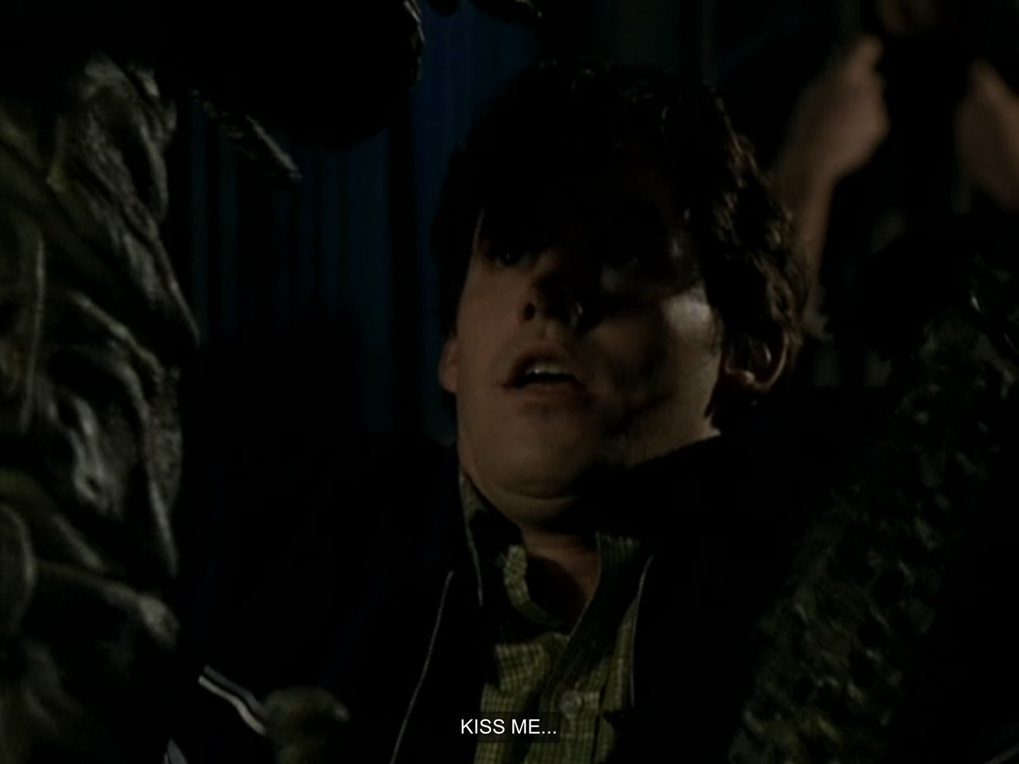 Xander recoiling in horror as a human-sized praying mantis says “kiss me.