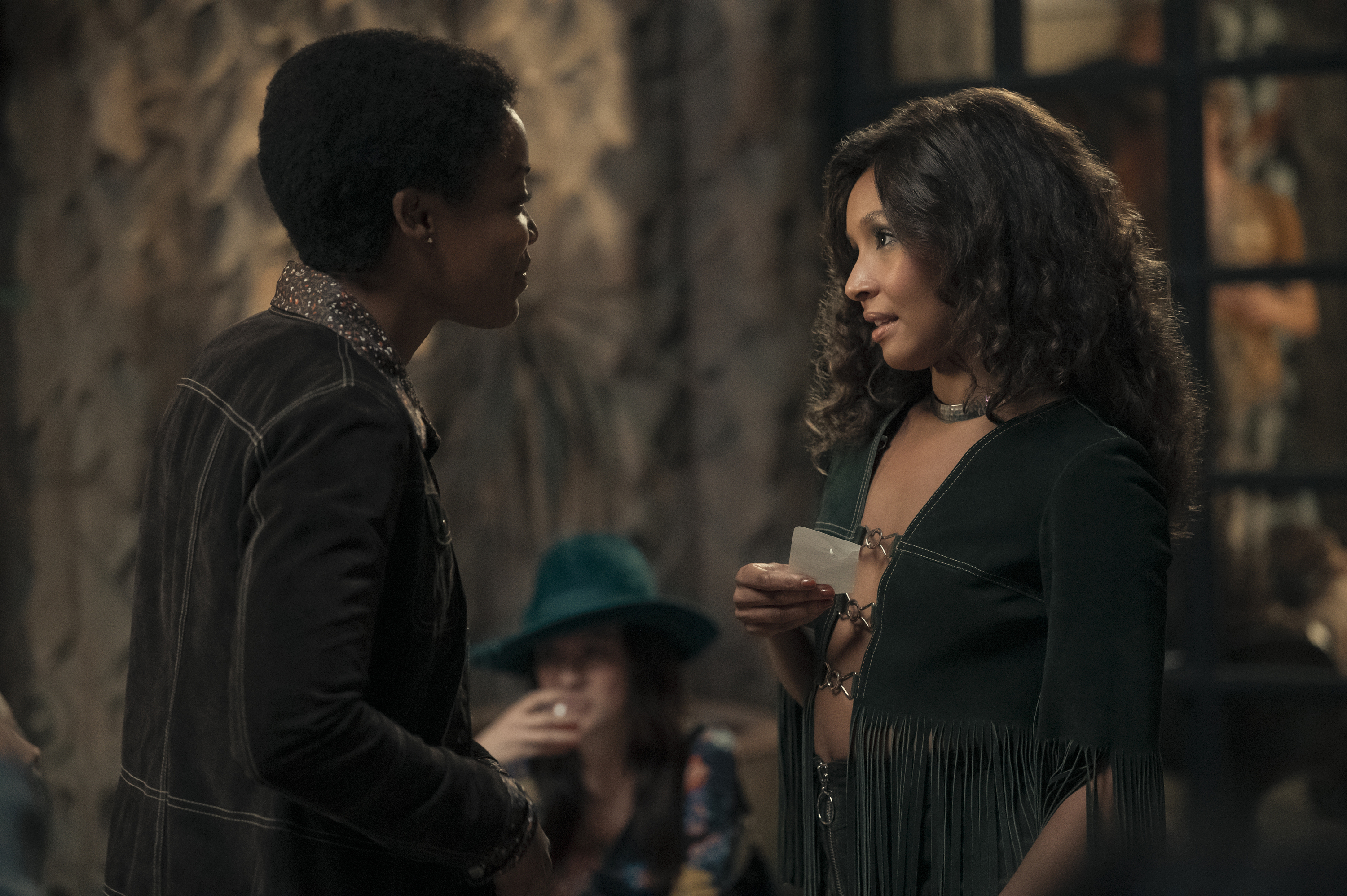 Simone and her girlfriend talking in Daisy Jones and the Six