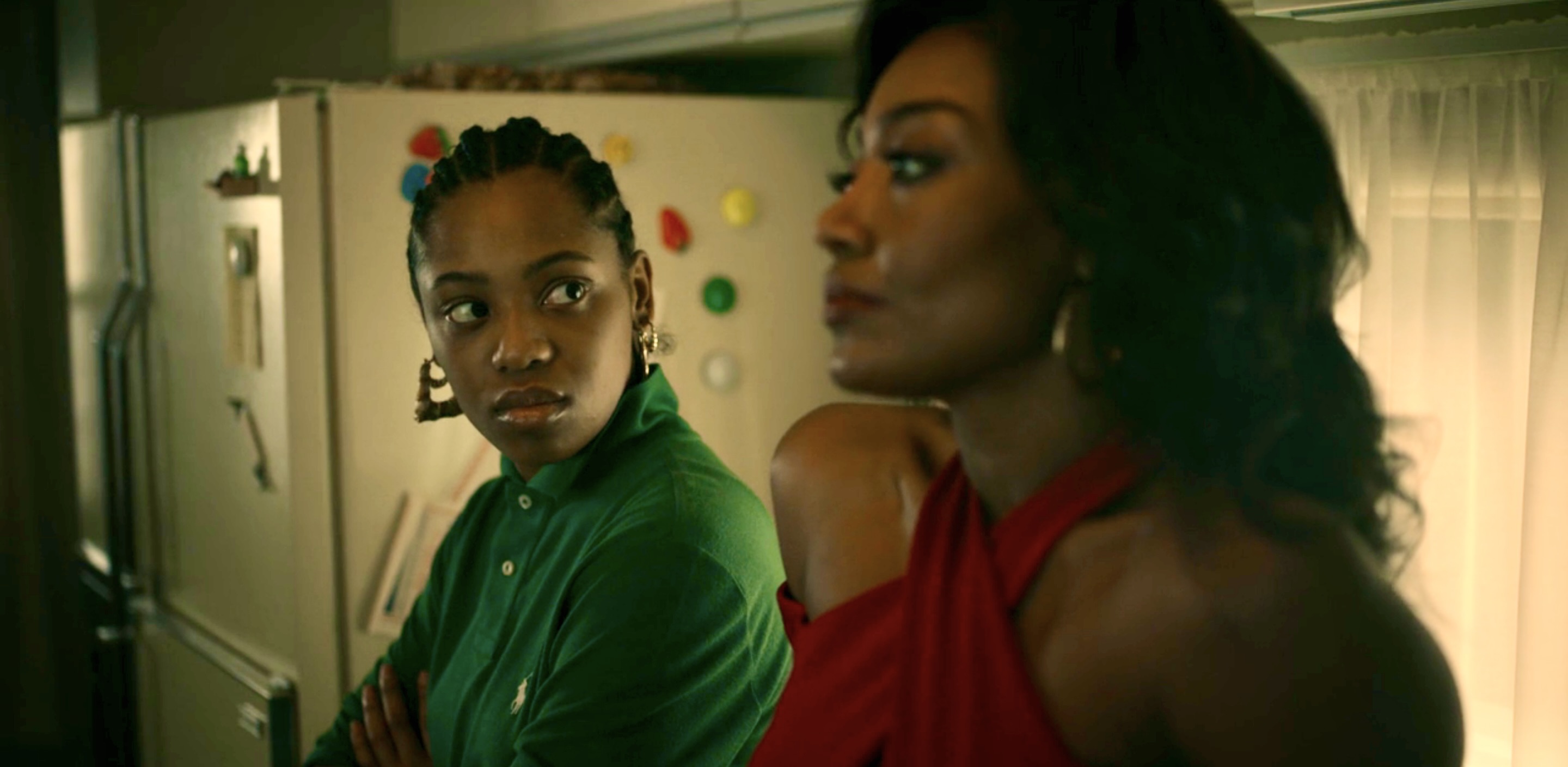 Jukebox stares at her Aunt Raquel in the kitchen