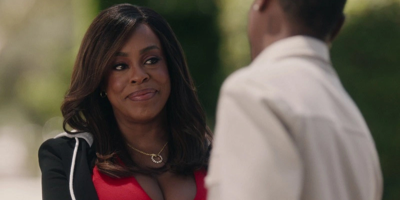 Simone, wearing a tight red shirt and black jacket, introduces herself to DJ.