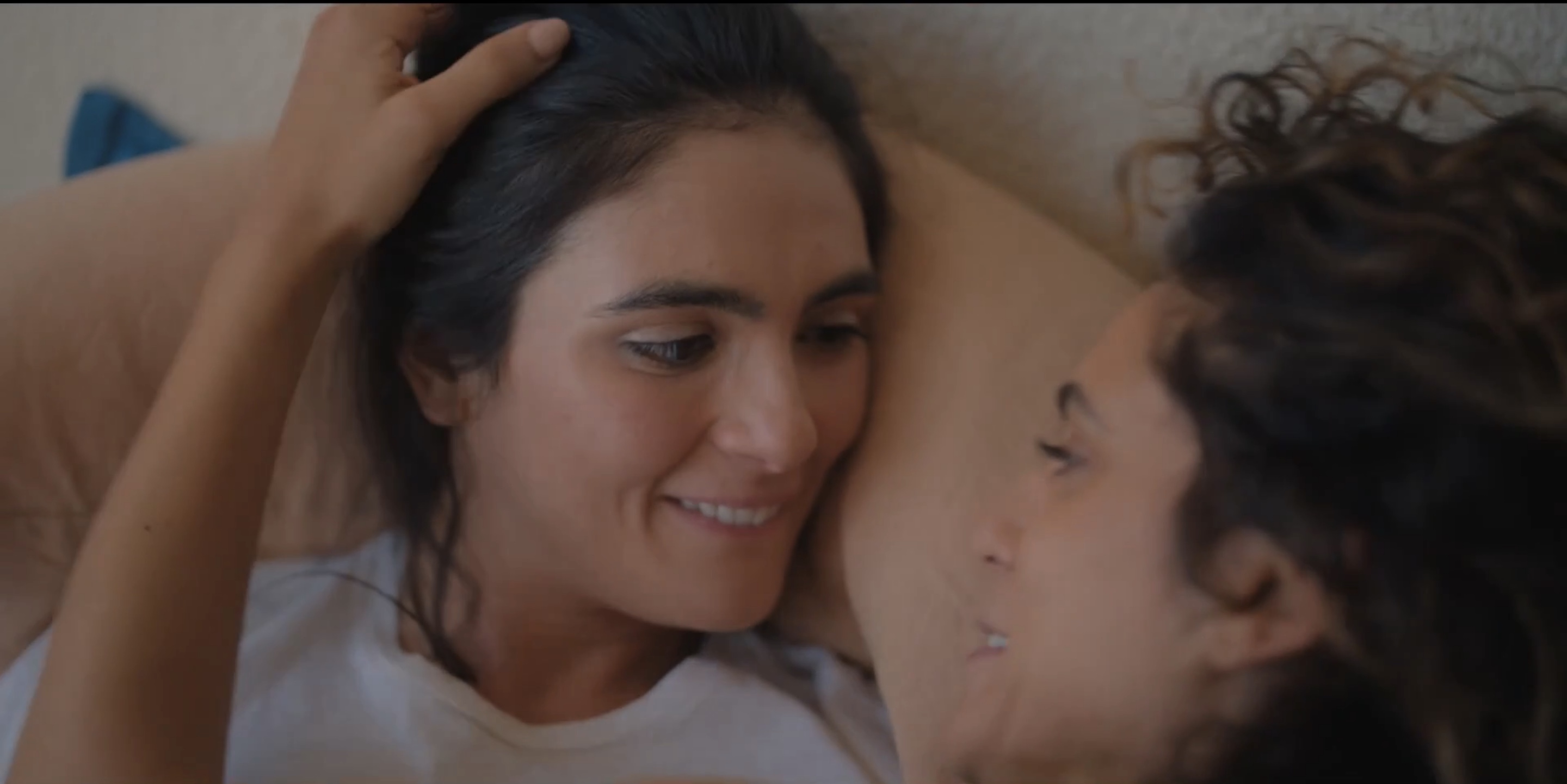 dani in bed looking cutely at gigi