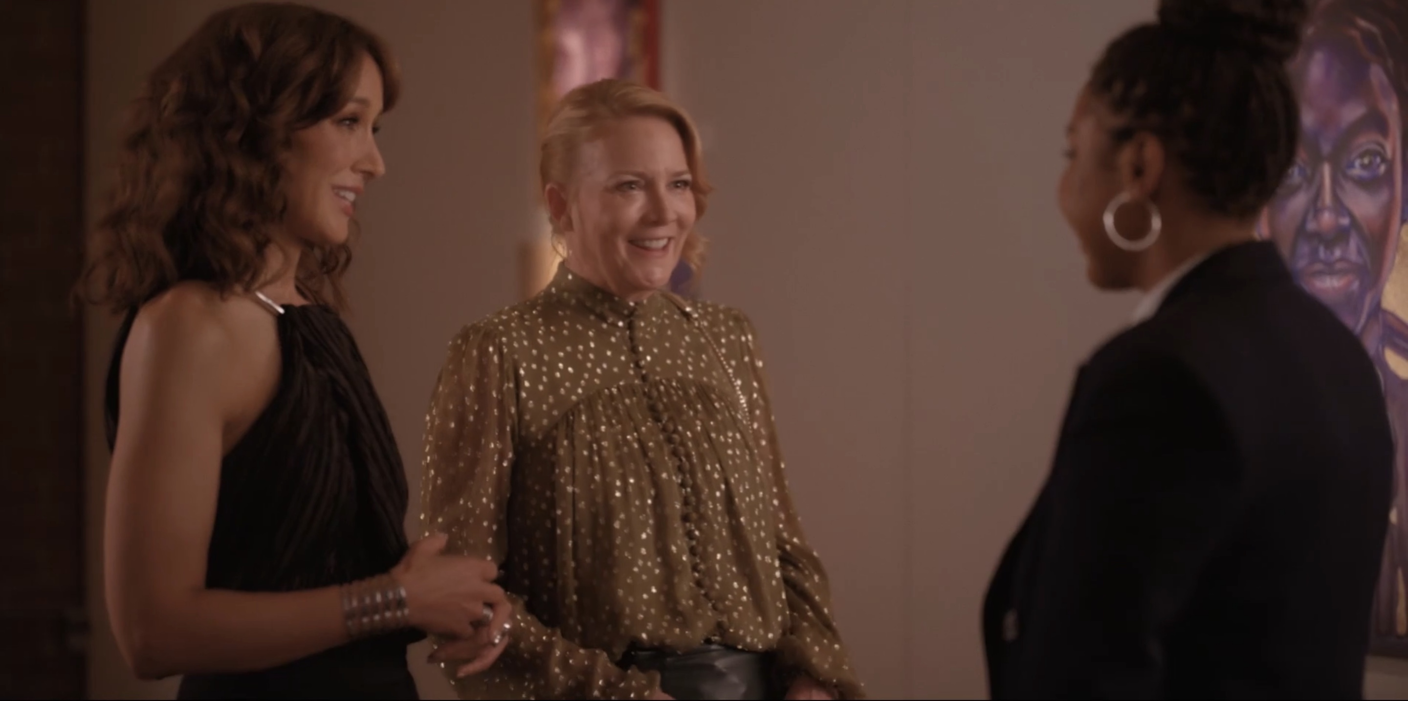 Bette and Tina smiling at Angie