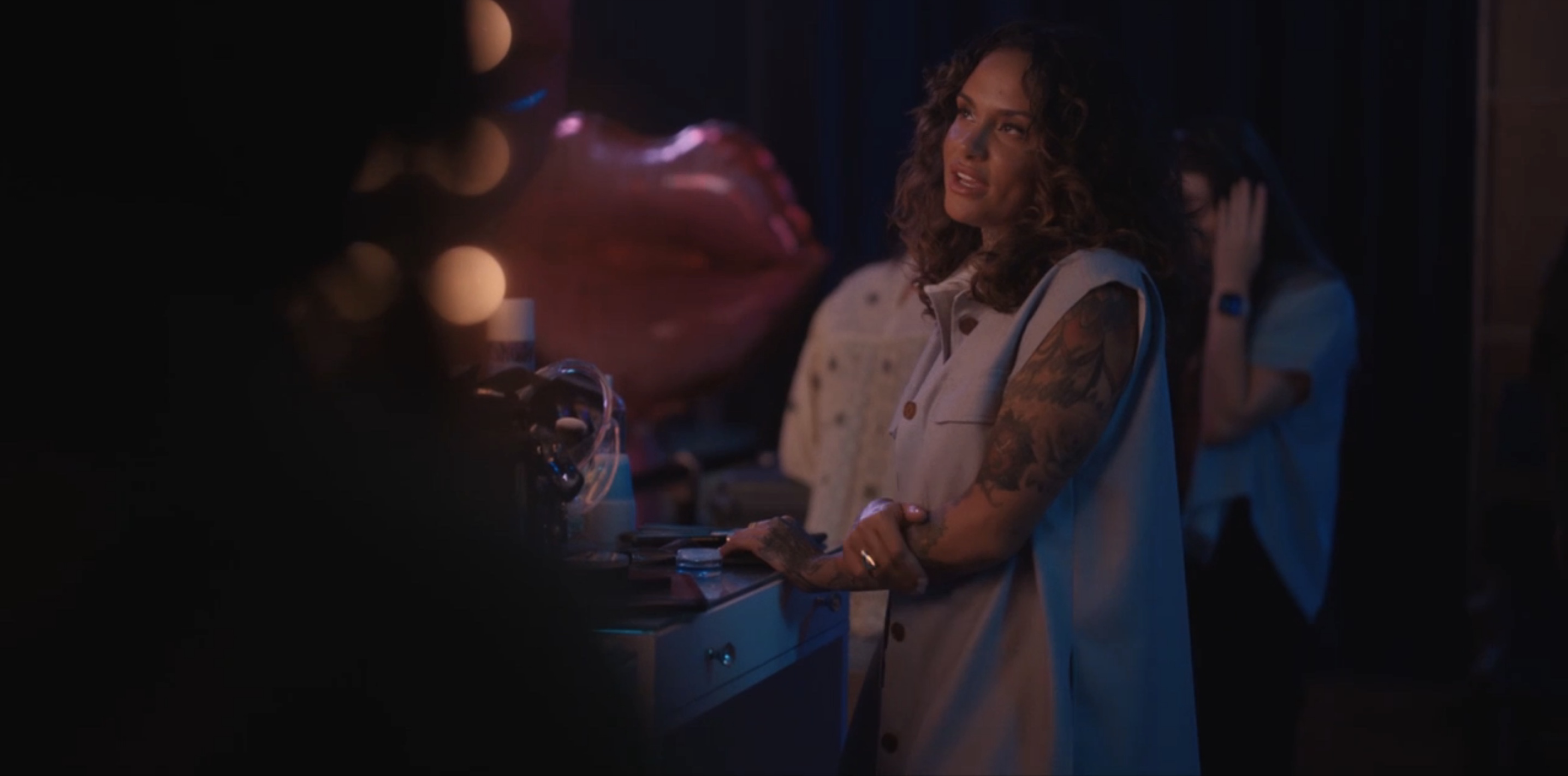 Kehlani thinking at the hair stand