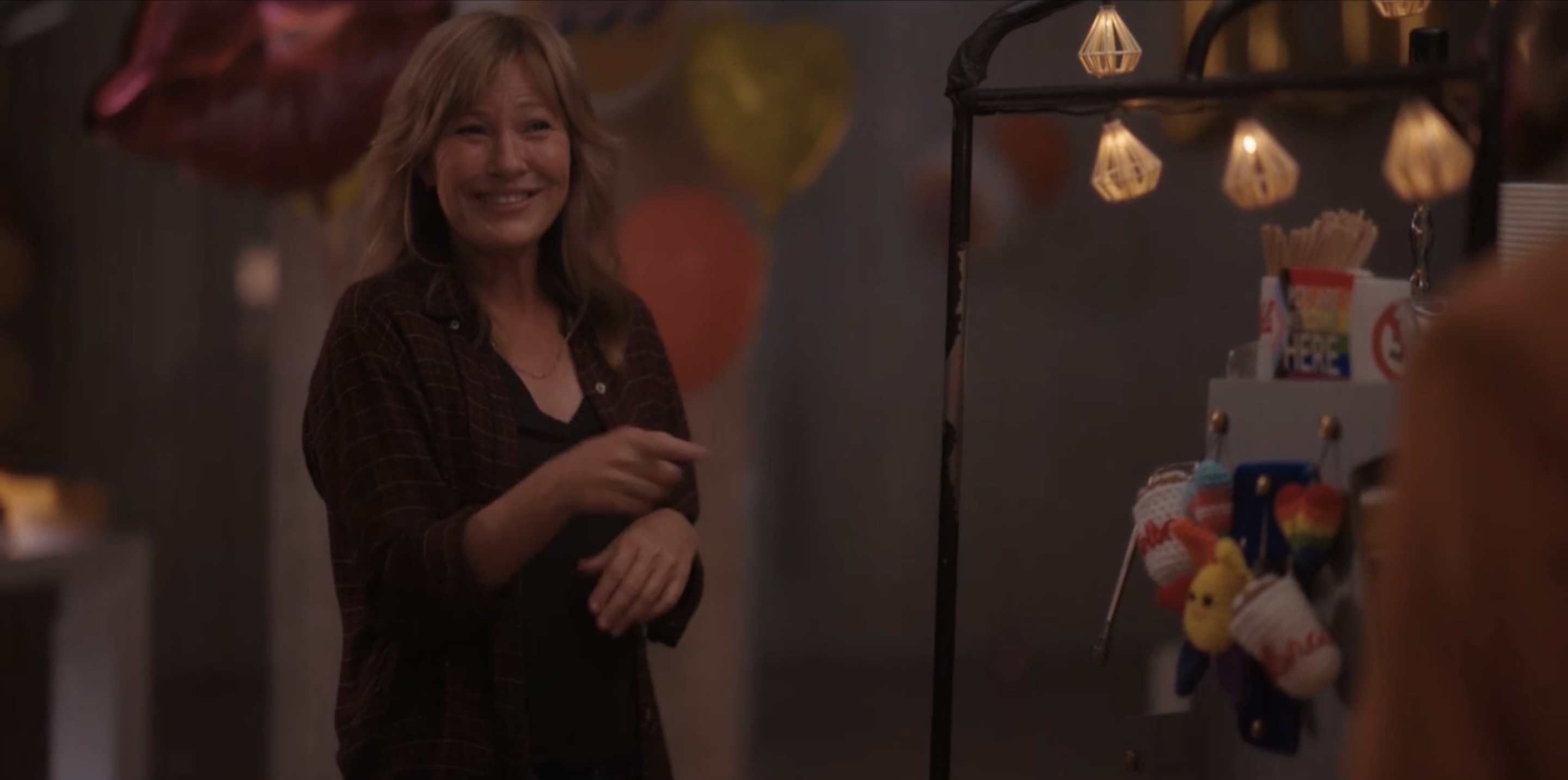 Taylor in a flannel shirt, cutely pointing at Alice