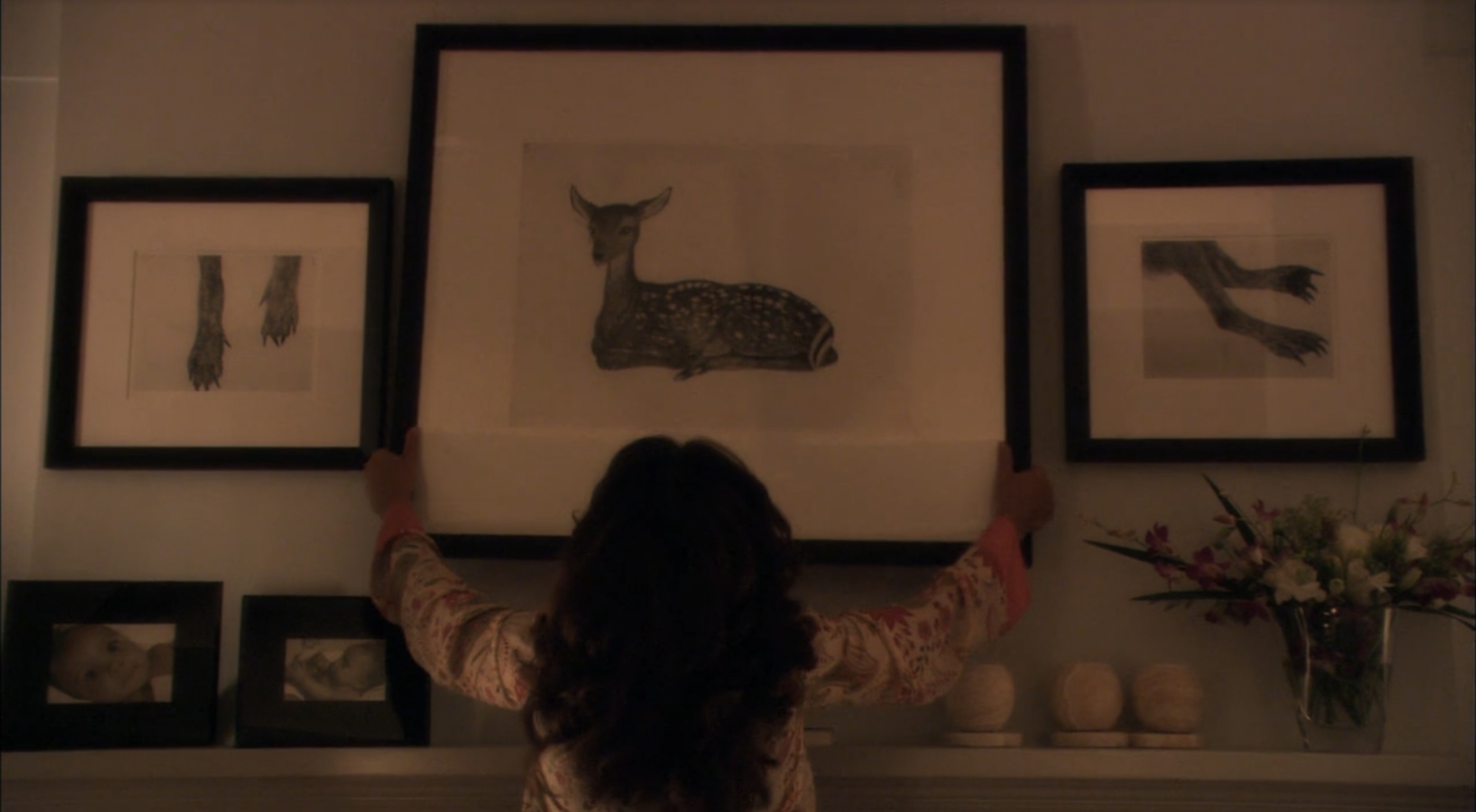 Bette takes down the Kiki Smith picture in a scene from Season Three of the original series