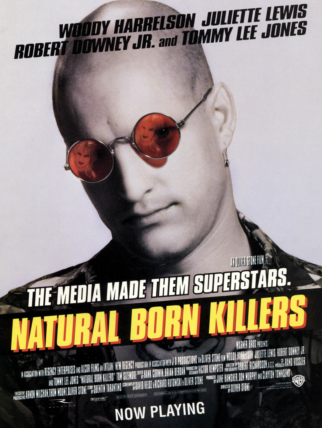 the cover of natural born killers featuring a man with a shaved head and red sunglasses