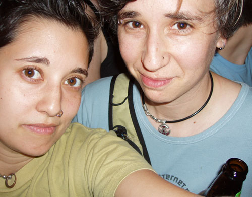 In the 2000s, Tracy and Mia pose for a selfie taken with a digital camera at a Team Dresch Show