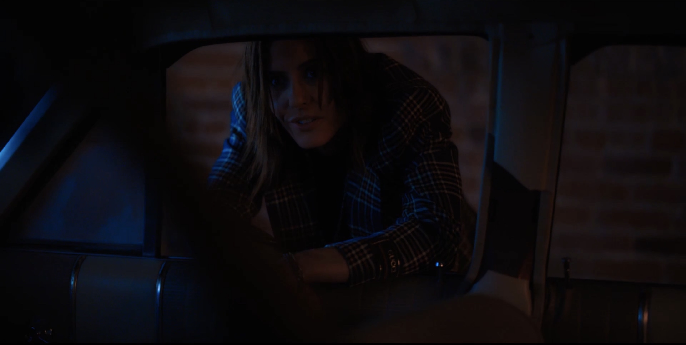 Shane leaning into Ivy's car window