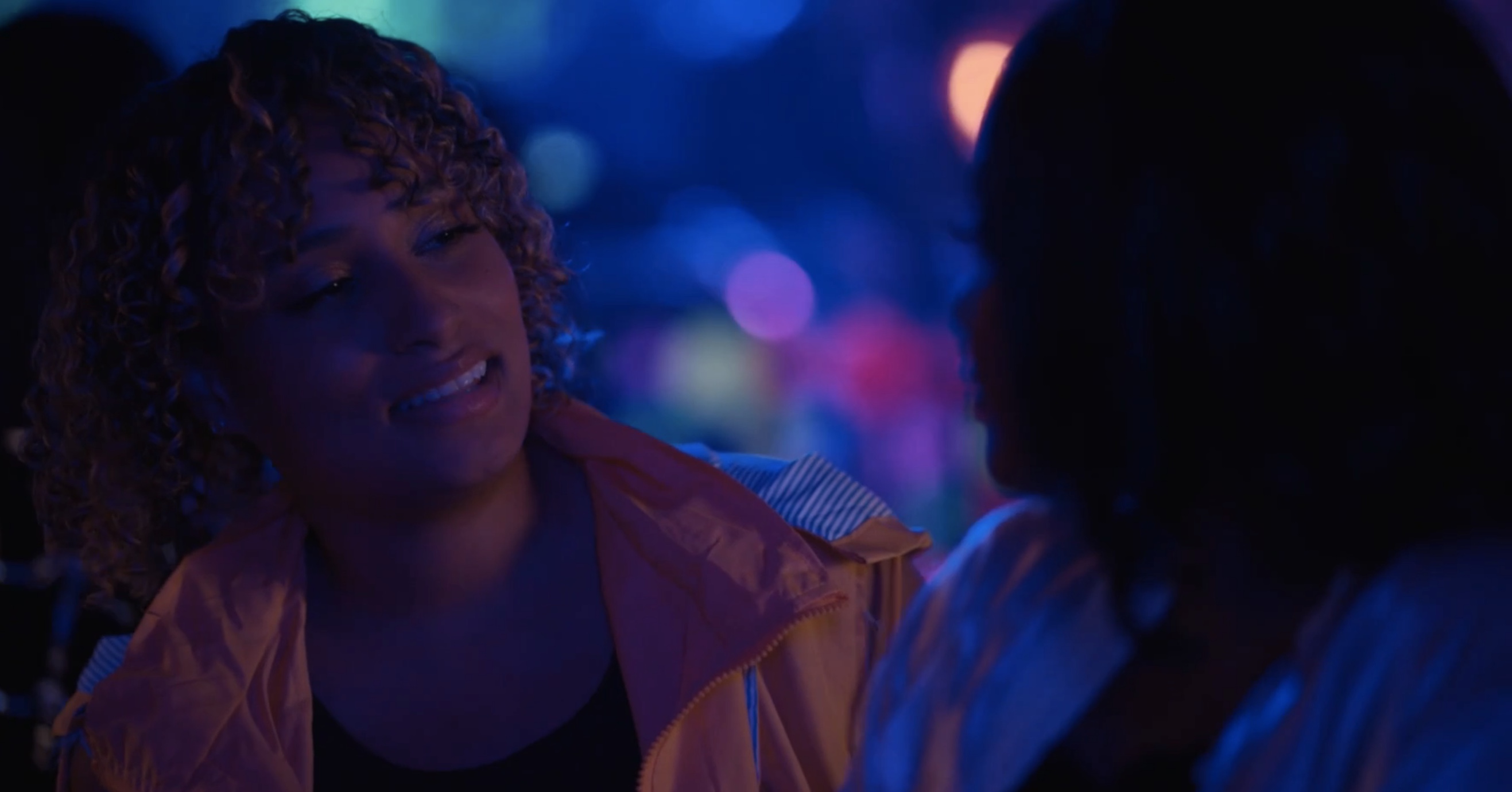 Sophie looking at the girl who wants to buy her a drink