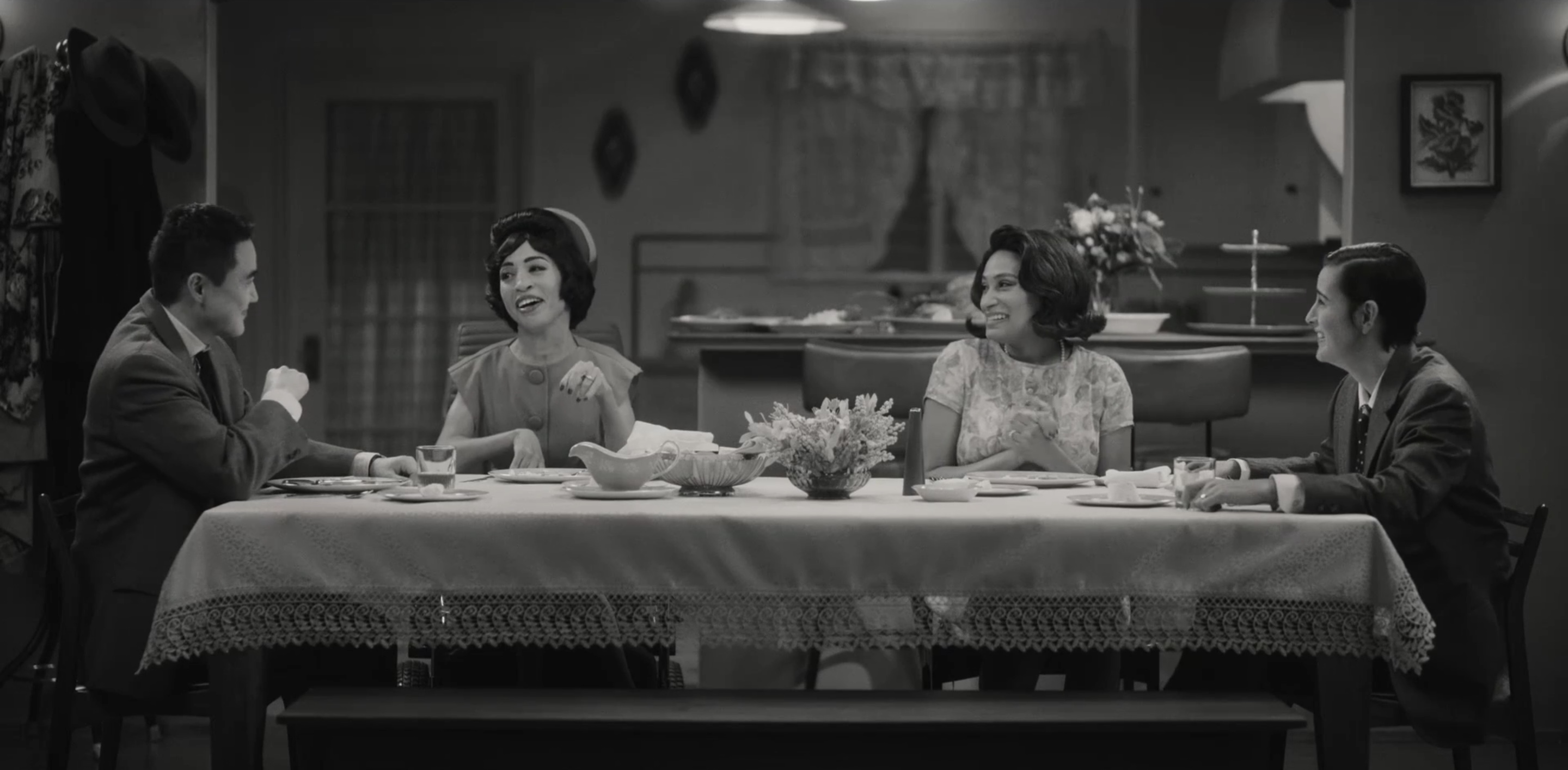 Micah, Maribel, Sophie and Finley at their dining room table laughing