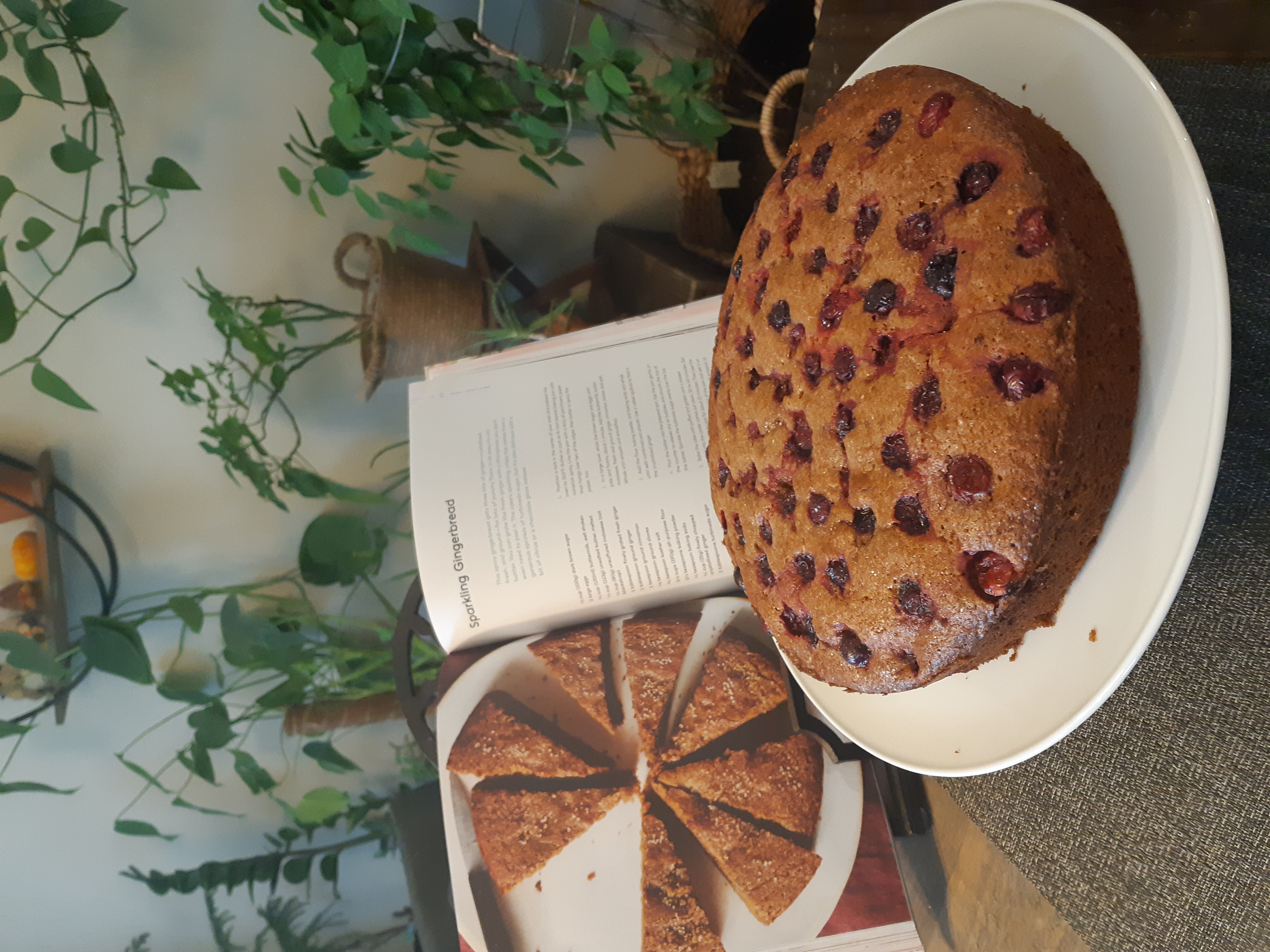 A gingerbread cake on a cake stand