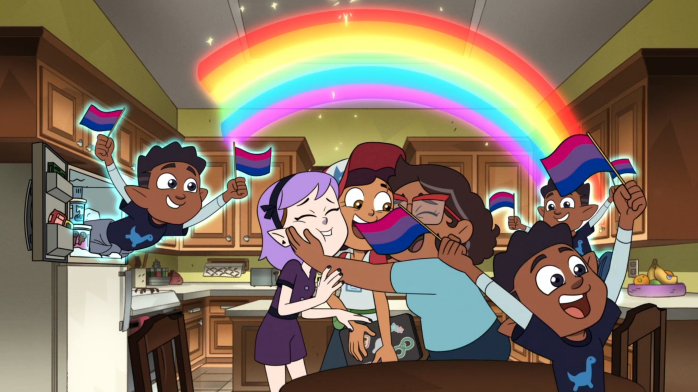 Camila embraces Luz and Amity while Gus whirls around with bisexual flags and a rainbow