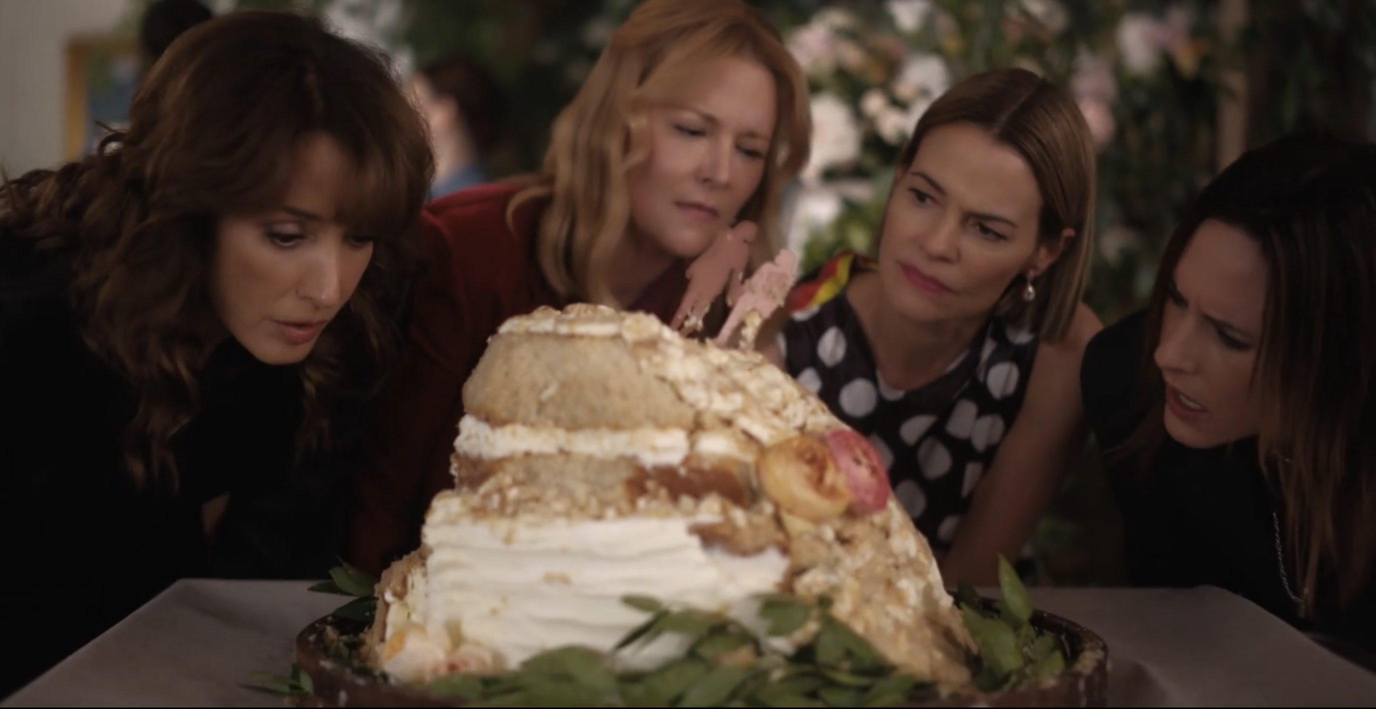 Bette, Tina, Alice and Shane looking at the cake