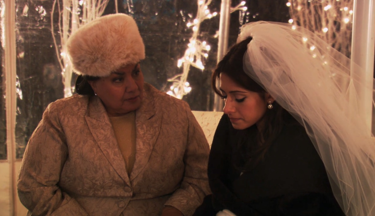 Carmen sitting with her Mom after being left at the altar