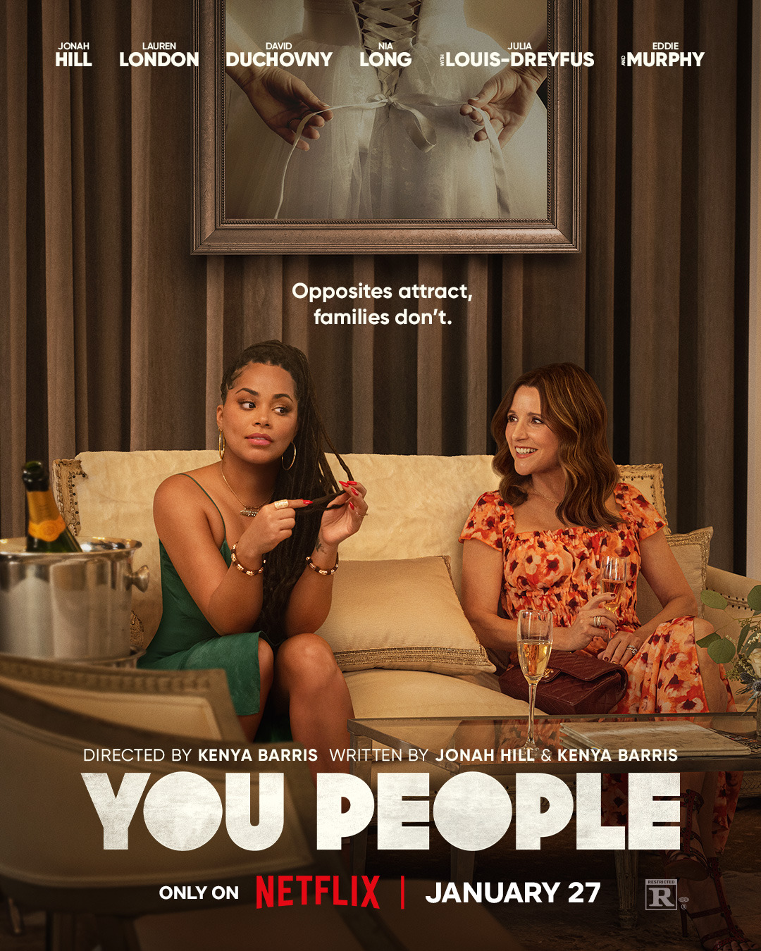 the cover of you people showing a black woman looking tested and a white woman looking like she's obliviously talking on a fancy couch. they both have champagne