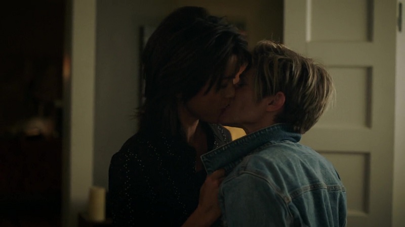 A Million Little Things: Katherine pulls Greta in for a kiss by the lapels of her denim jacket.
