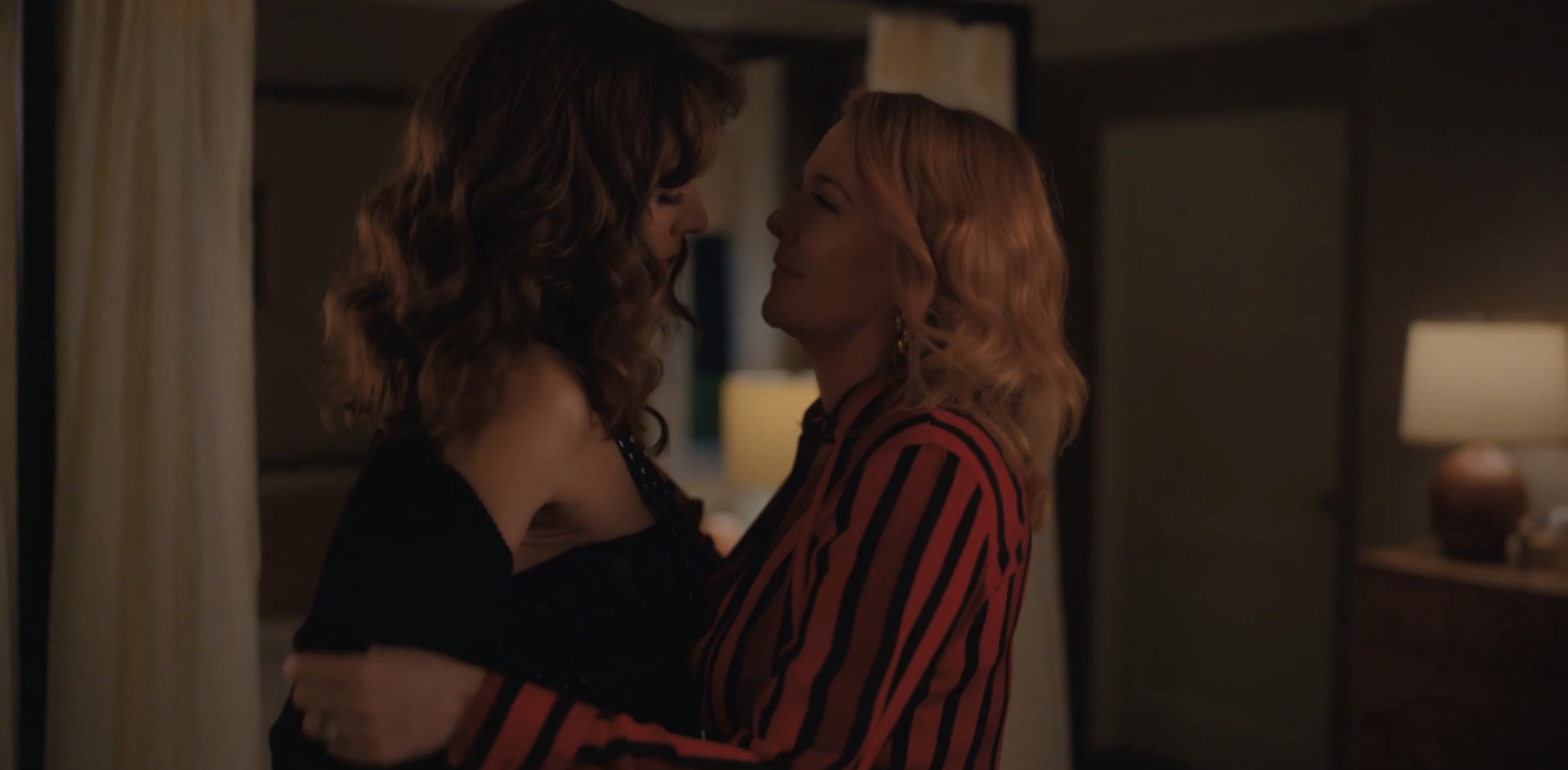 Tina removing Bette's shirt