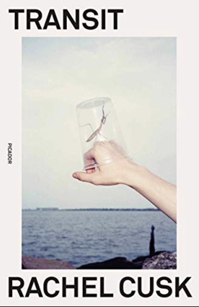 the cover of transit has a photo of a white hand with a glass on it in front of an ocean