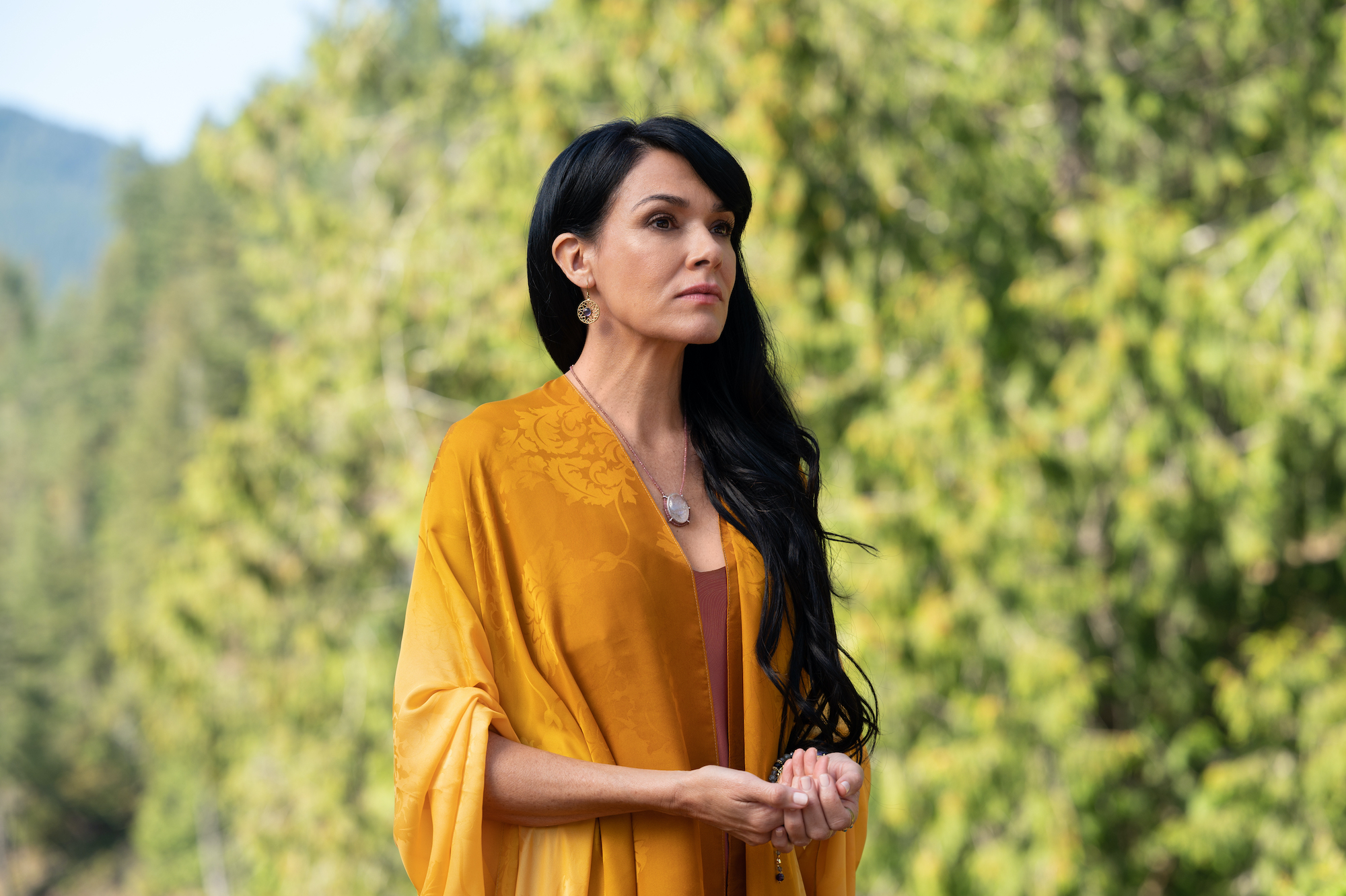 Yellowjackets Simone Kessell as Lottie in YELLOWJACKETS wears a yellow robe dress. Season 2. Photo Credit: Kimberley French/SHOWTIME.
