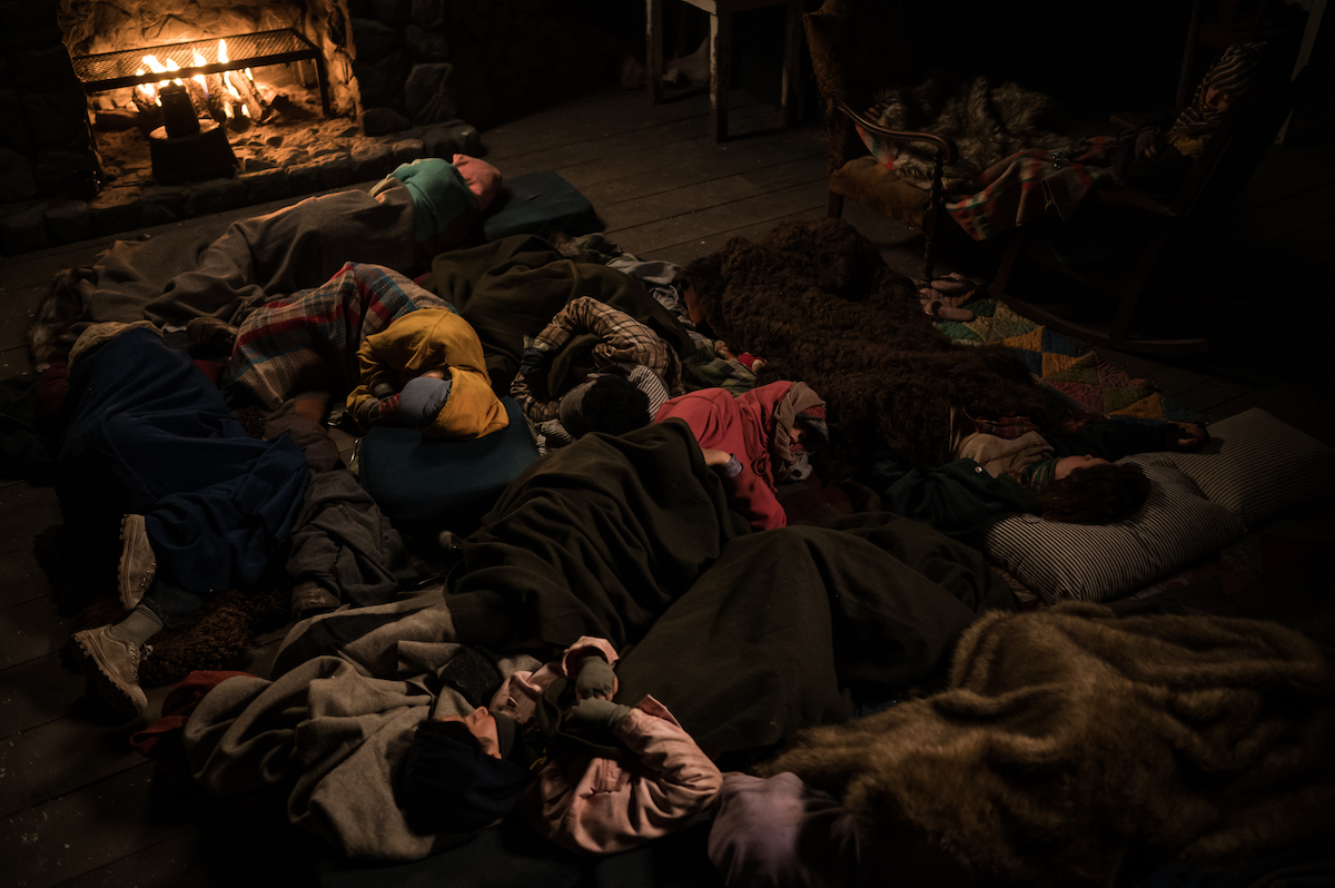 Yellowjackets A still from YELLOWJACKETS showing everyone in the cabin asleep. Season 2. Photo Credit: Kailey Schwerman/SHOWTIME.