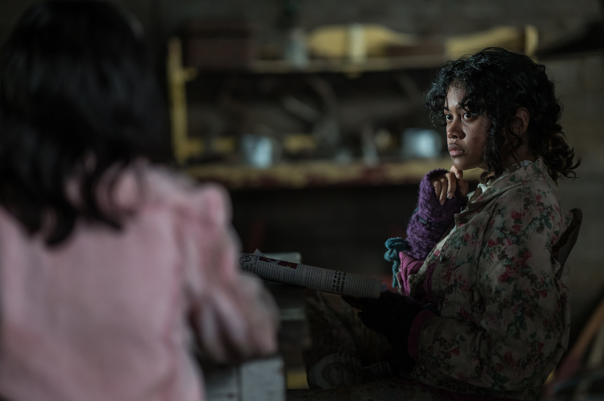 Yellowjackets Nuha Jes Izman as Teen Crystal in YELLOWJACKETS Season 2 sits at a table. Photo Credit: Kailey Schwerman/SHOWTIME.