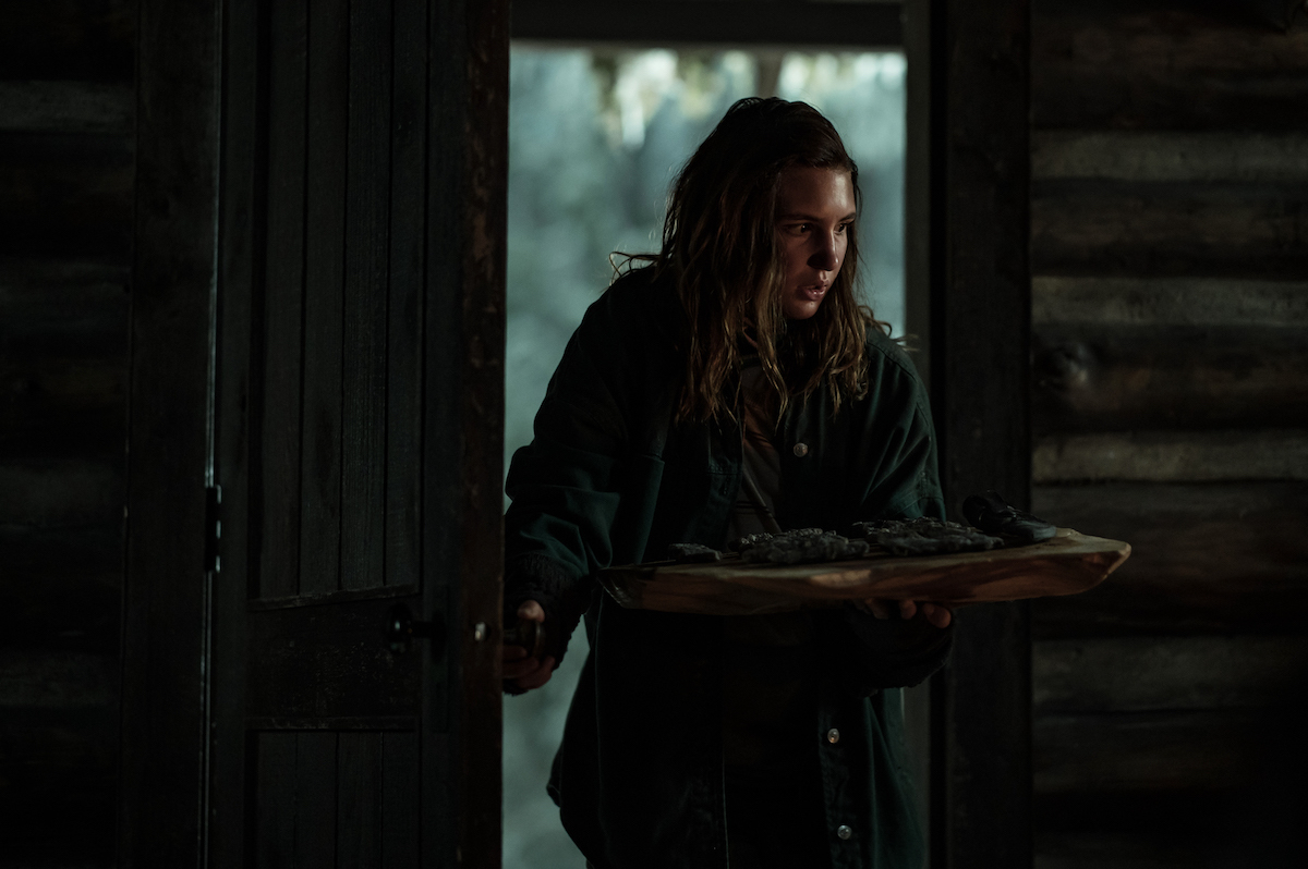 Yellowjackets Sophie Nélisse as Teen Shauna in YELLOWJACKETS Season 2 walks into the cabin. Photo Credit: Kailey Schwerman/SHOWTIME.