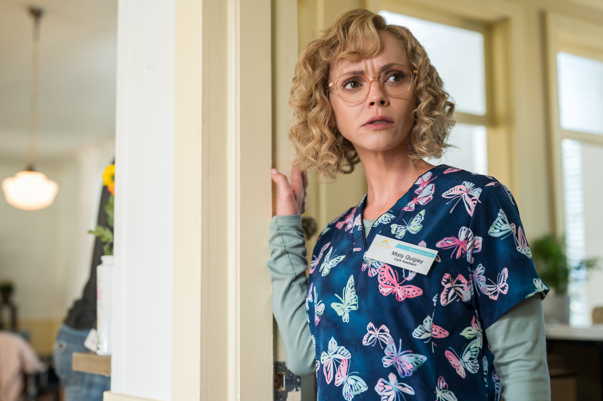Yellowjackets - Season 2 Christina Ricci as Misty in YELLOWJACKETS Season 2 wears butterfly scrubs and looks concerned. Photo Credit: Kailey Schwerman/SHOWTIME.