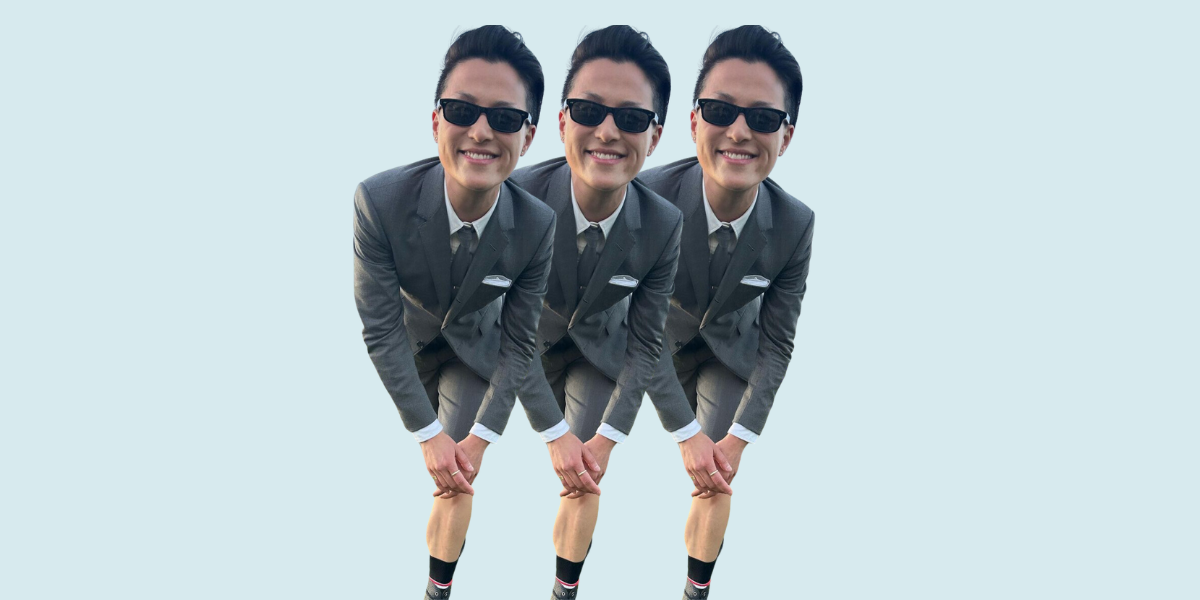 chef Melissa King in a suit and sunglasses leaning forward