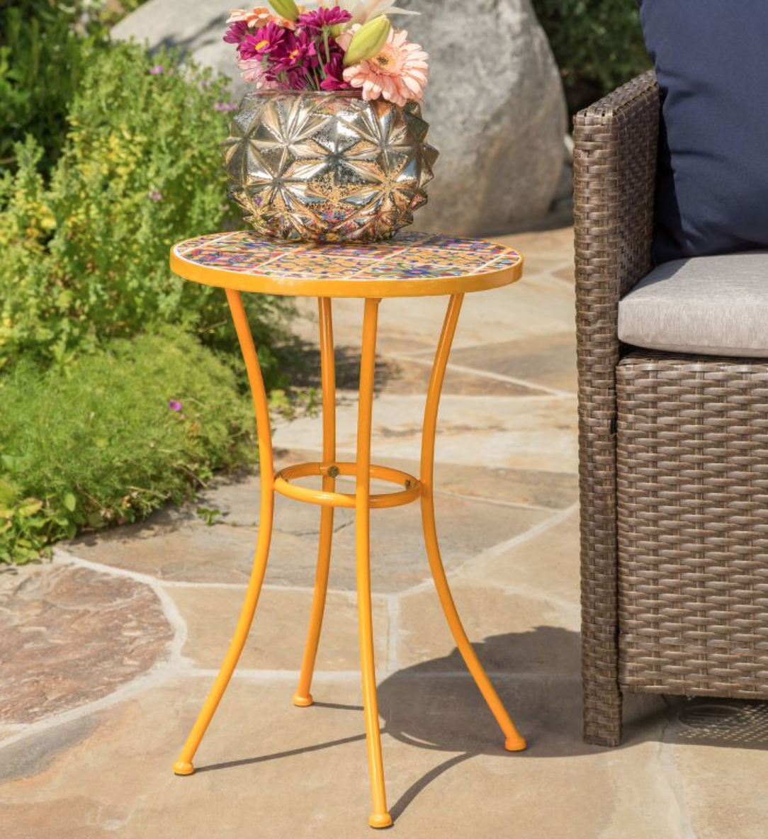 a ceramic tile side table in yellow, orange, and blue