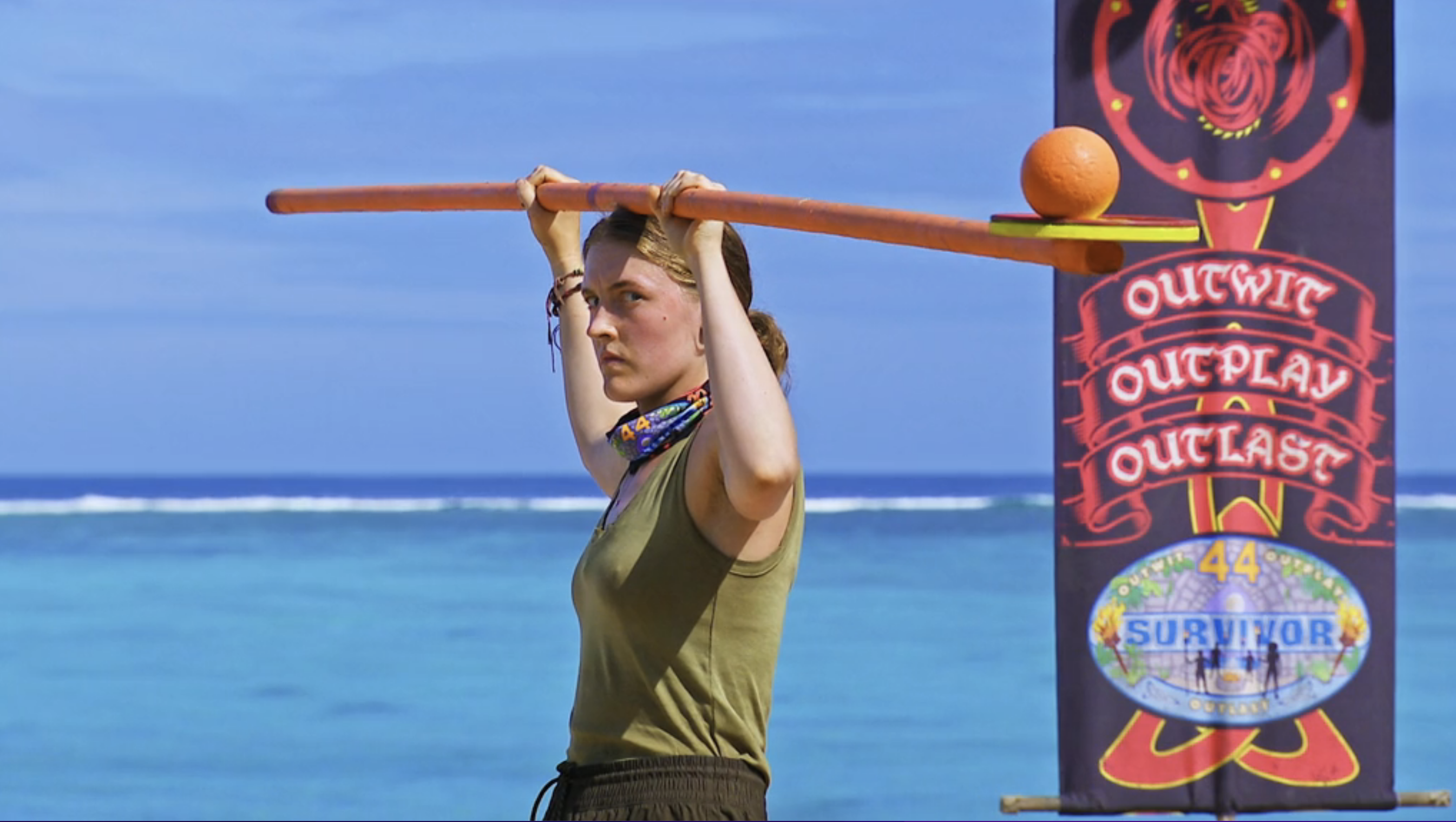 Survivor Season 44 contestant Frannie Marin holds a large beam on her head, on top of which balances a ball, in a challenge on Survivor