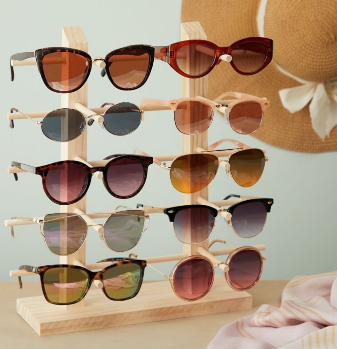 a sunglasses display with ten pairs of sunglasses on it