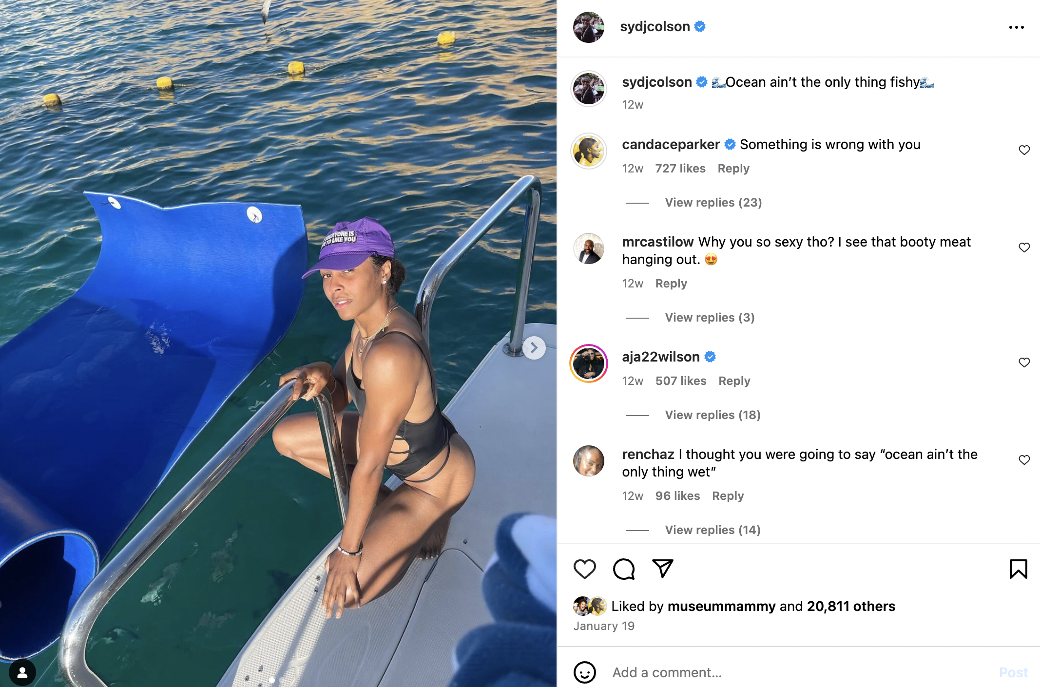 Sydney Colson is in a bathing suit and baseball cap on her instagram. The caption reads: "The ocean ain't the only thing that's fishy" and many different WNBA players are joking with Syd in the comments below.