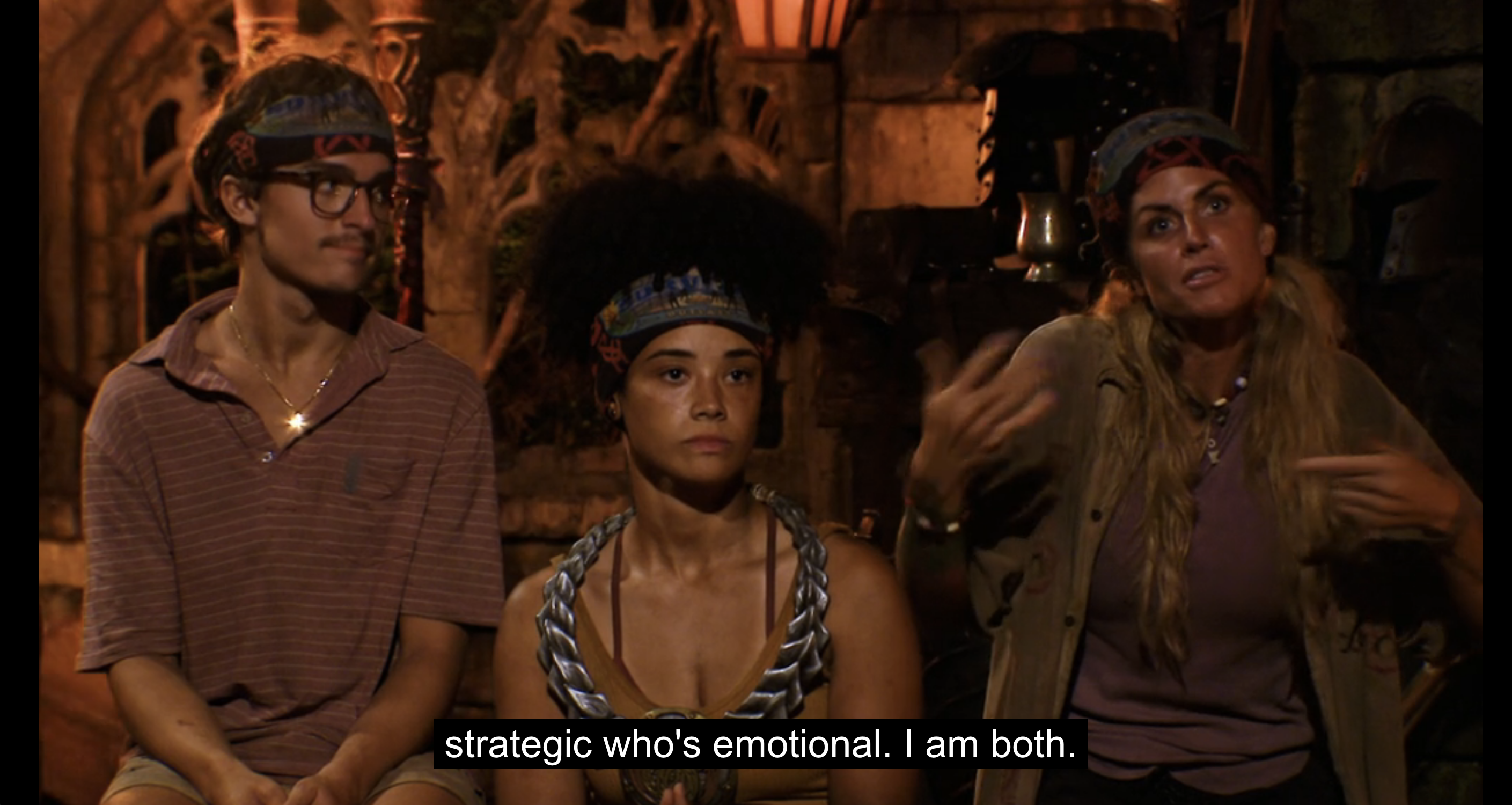 Survivor Season 44 contestant Carolyn Wiger at tribal council, explaining with wild gesticulations that she is both emotional and strategic.