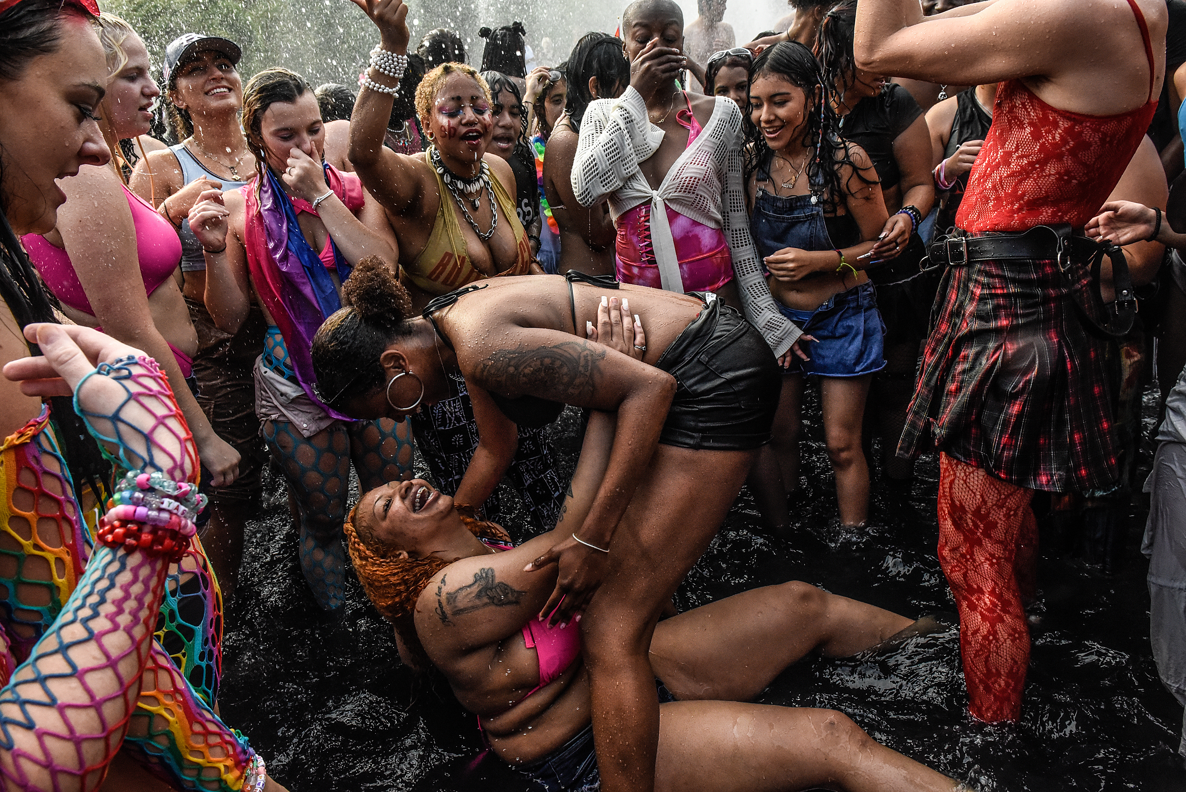 NEW YORK, NEW YORK - JUNE 25: People play in the fountain on June 25, 2023 in Washington Square Park in New York City. Washington Square Park has become a recurrent place for thousands to gather during Pride Day marches on this day. (Photo by Stephanie Keith/Getty Images)