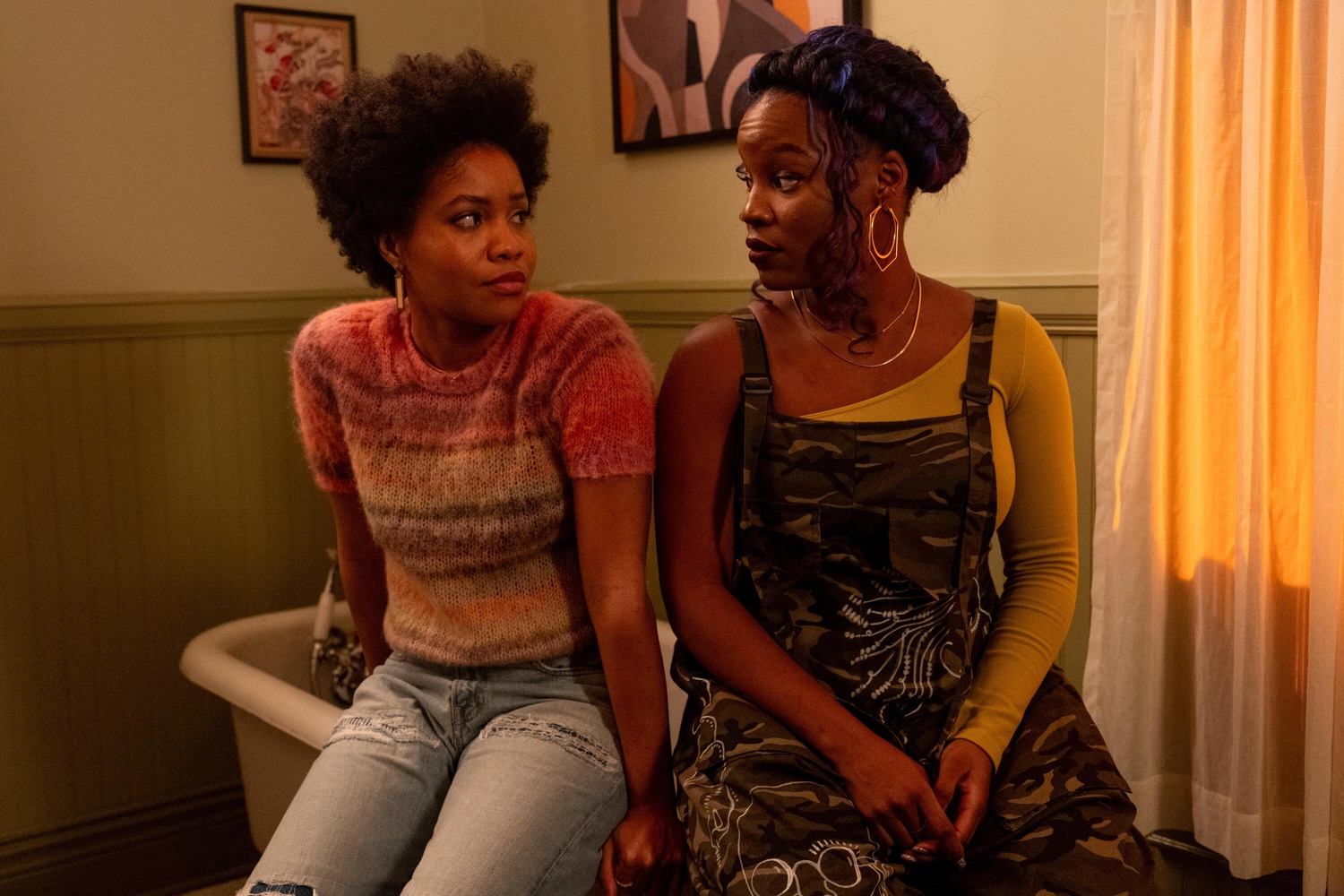 mailaka and nella giving each other a look on the