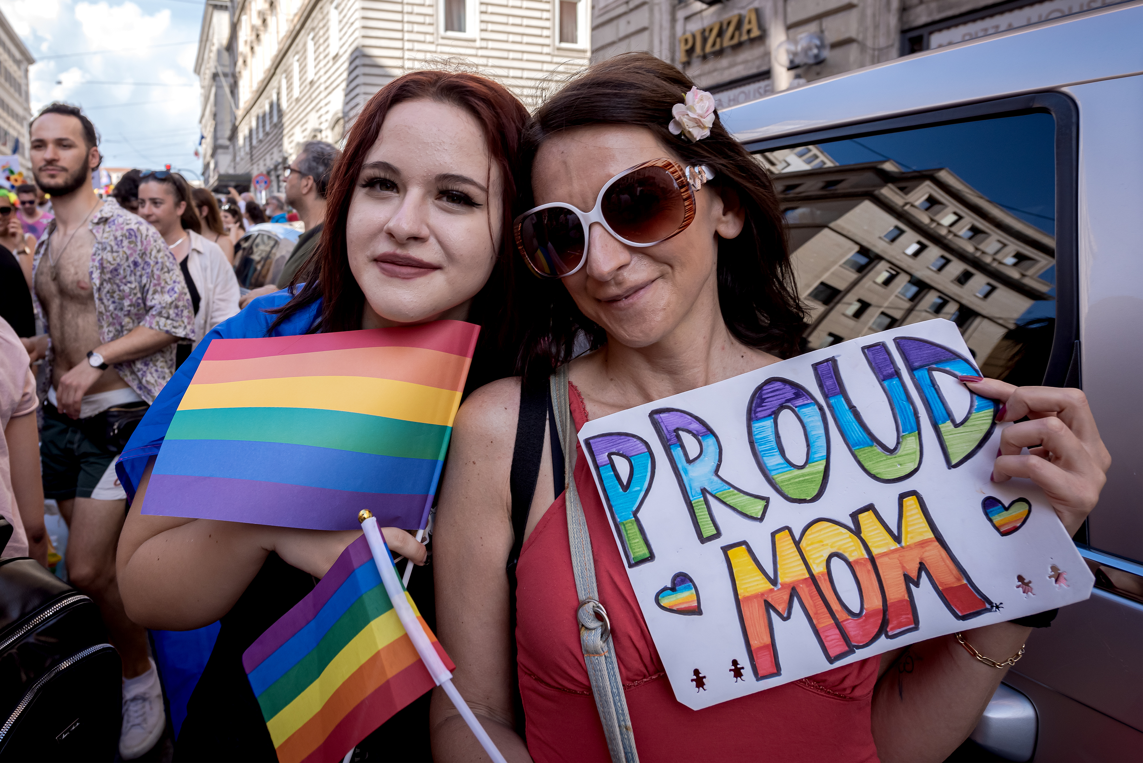ROME, ITALY - JUNE 10: People attend Rome Pride Parade 2023 on June 10, 2023 in Rome, Italy. This year, the organisers chose the theme 'Queeresistenza' (Queer Resistance), with campaigners condemning what they called "multiple attacks" on the LGBTQ community suffered since Prime Minister Giorgia Meloni's government took office, and also proudly claiming that there are different families and relationships that cannot be ignored. The regional government withdrew sponsorship for the event, accusing the organisers of using the event to lobby in favour of surrogacy, which is illegal in Italy. (Photo by Stefano Montesi - Corbis/Corbis via Getty Images)