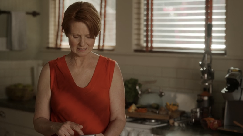 Miranda looks annoyed at her phone.