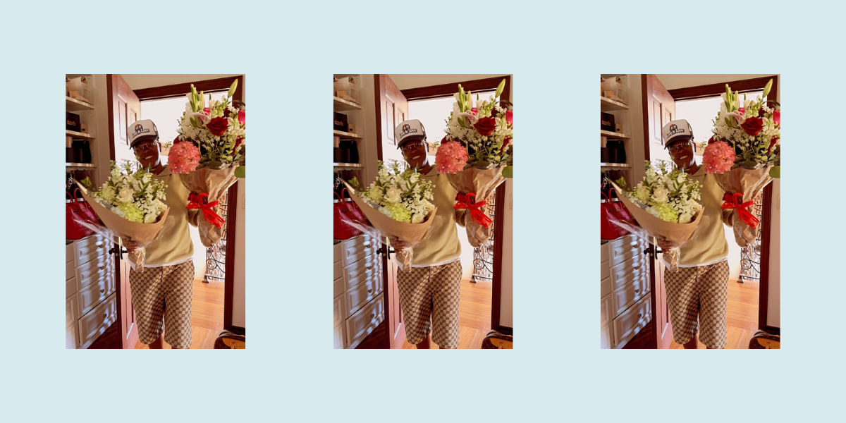 Jessica Betts holding two gigantic bouquets of flowers