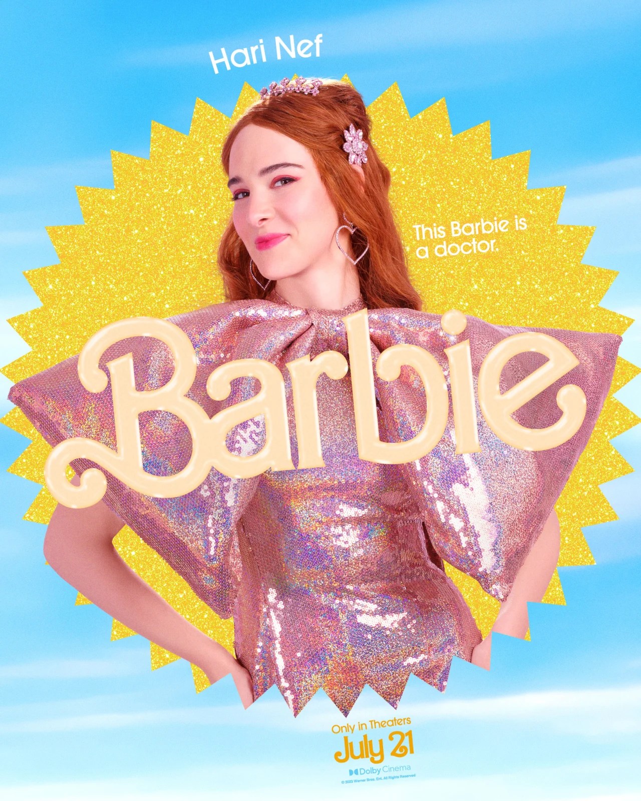 Hari Nef as Doctor Barbie (she has on a sparkly pink dress with a large bow in front)