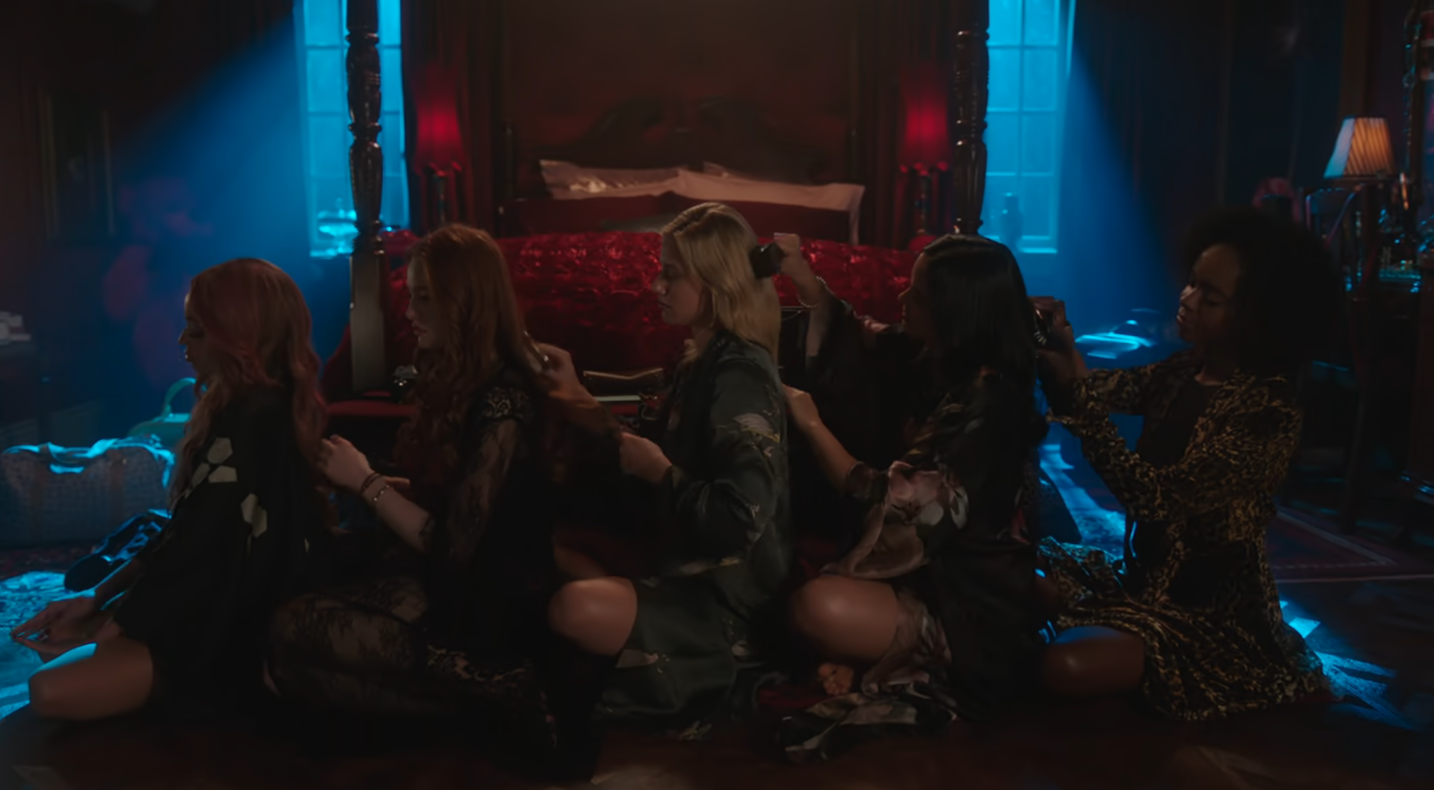 Toni, Cherul, Betty, Veronica, and Josie brush each other's hair in Riverdale