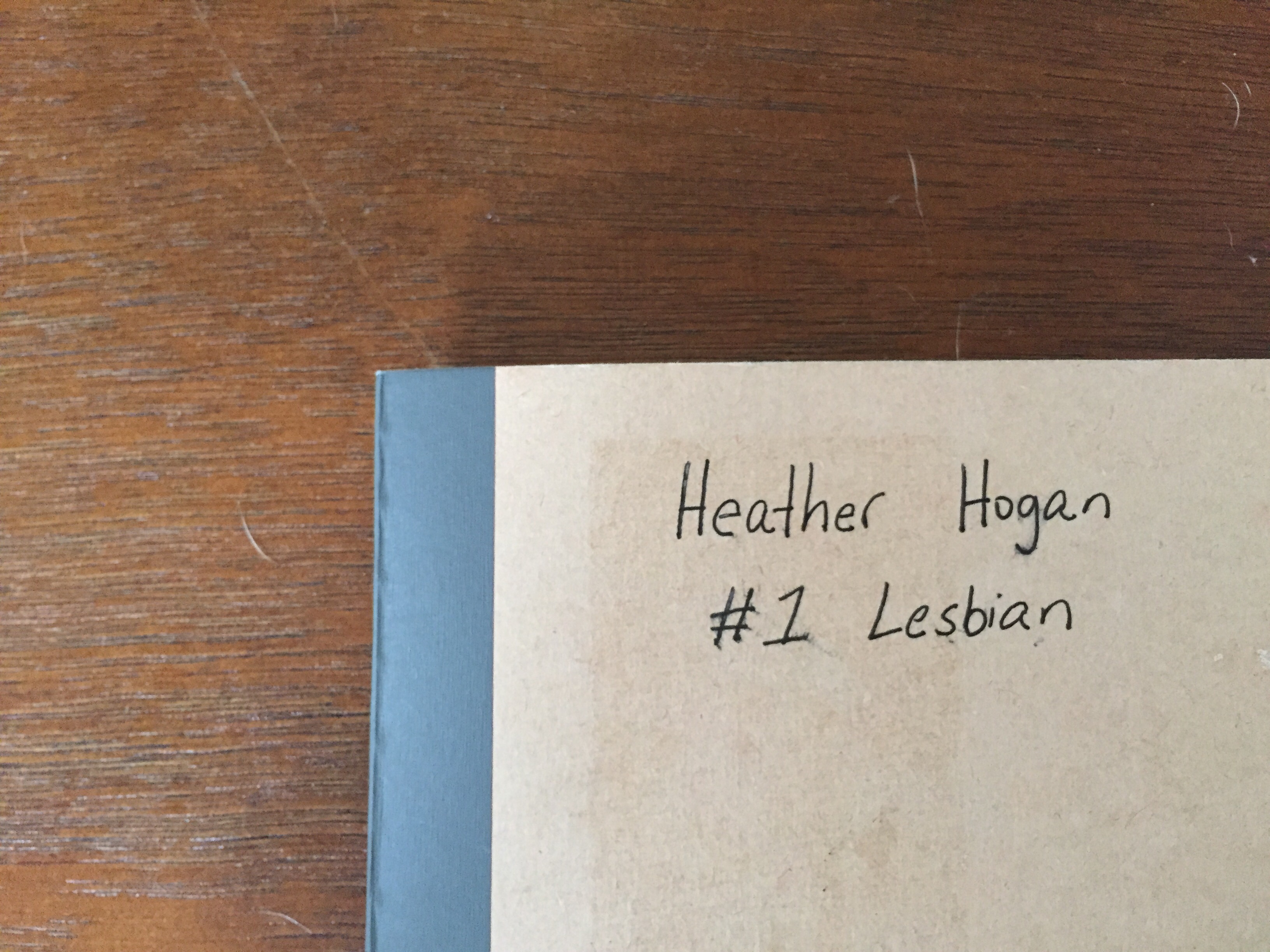 notebook that reads "Heather Hogan: #1 Lesbian"