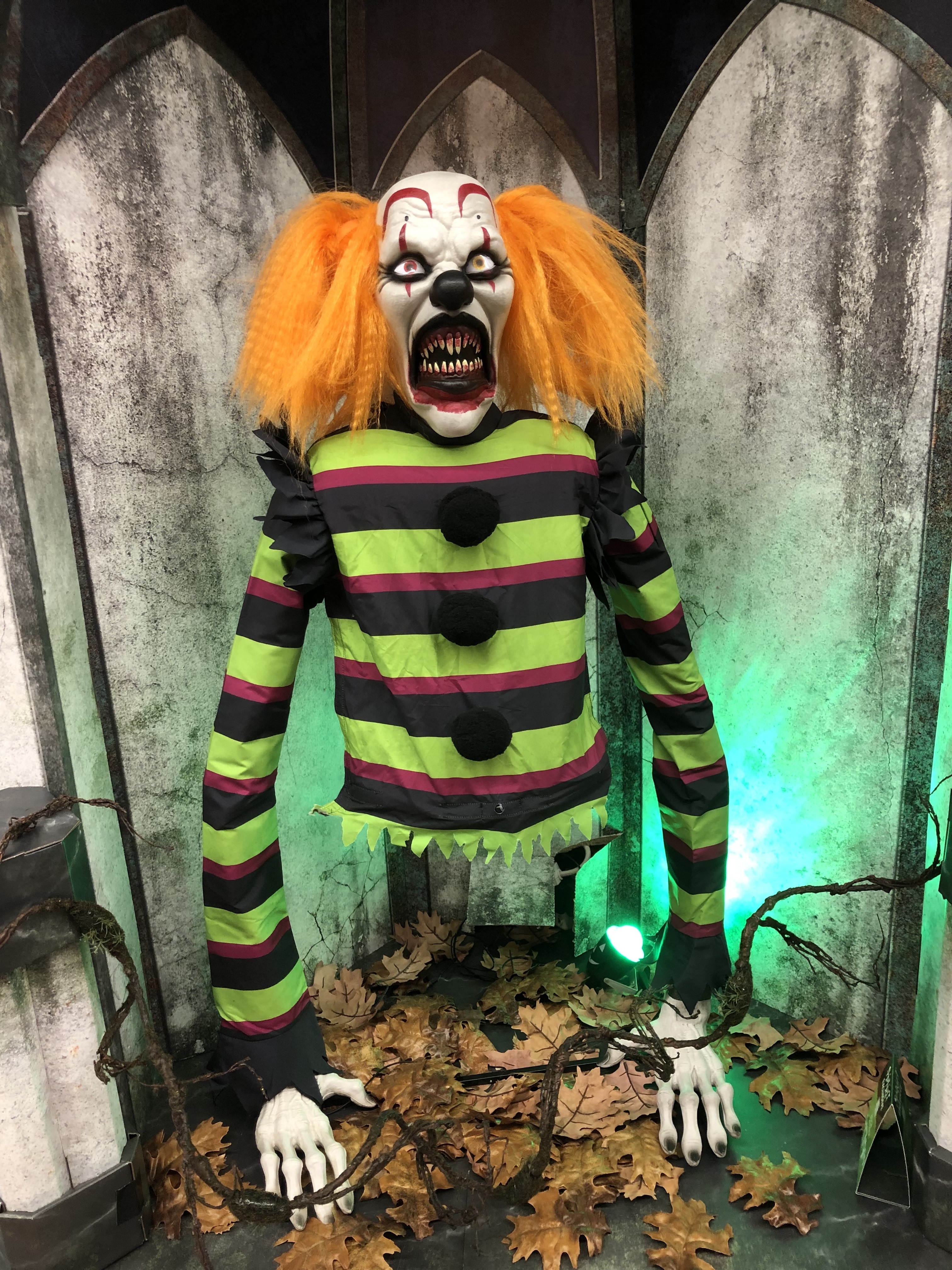 a clown with orange hair and only a torso and arms
