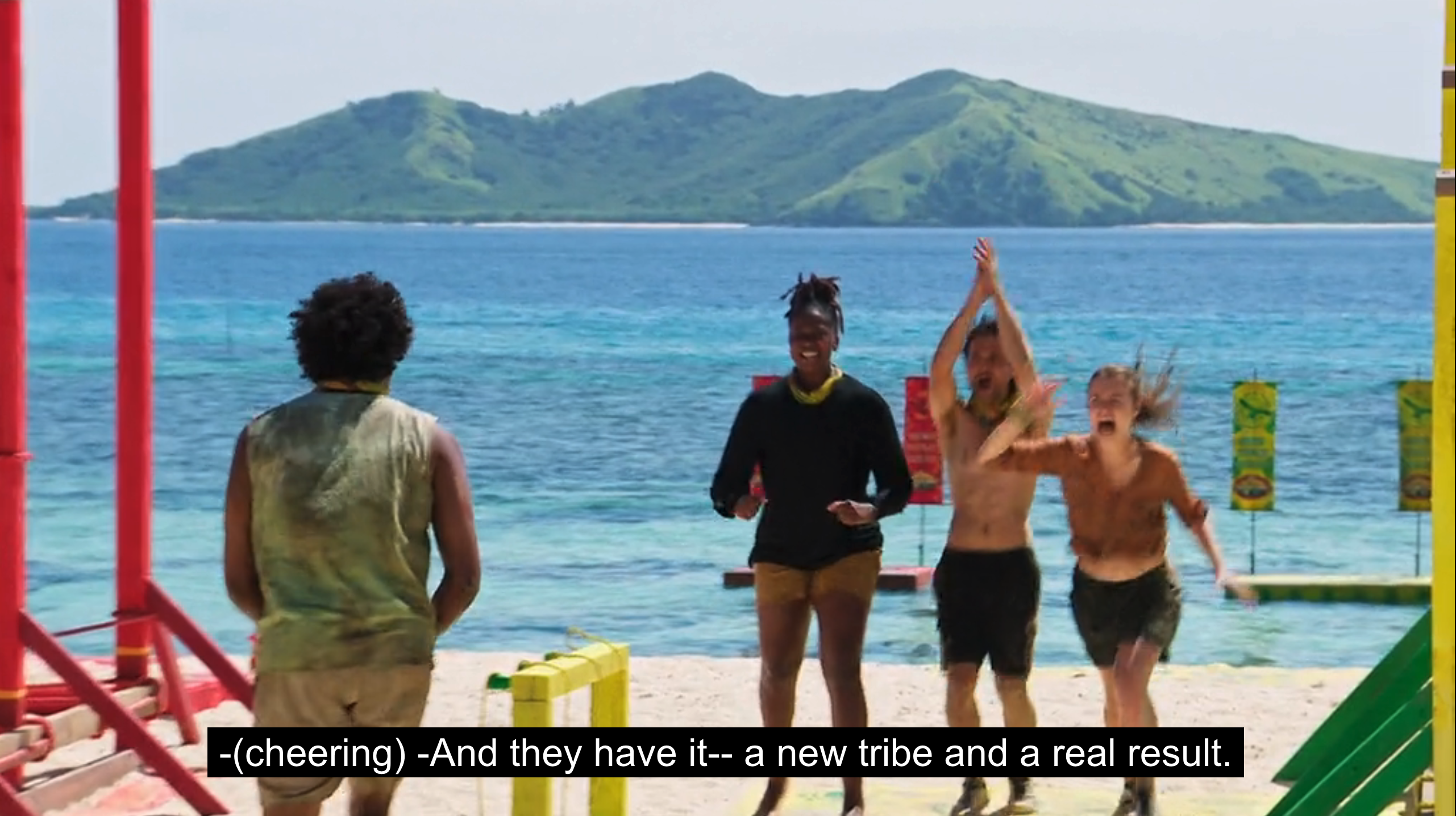 Members of the Lulu tribe on Survivor Season 45 celebrate by jumping up joyously, moments after winning the reward challenge